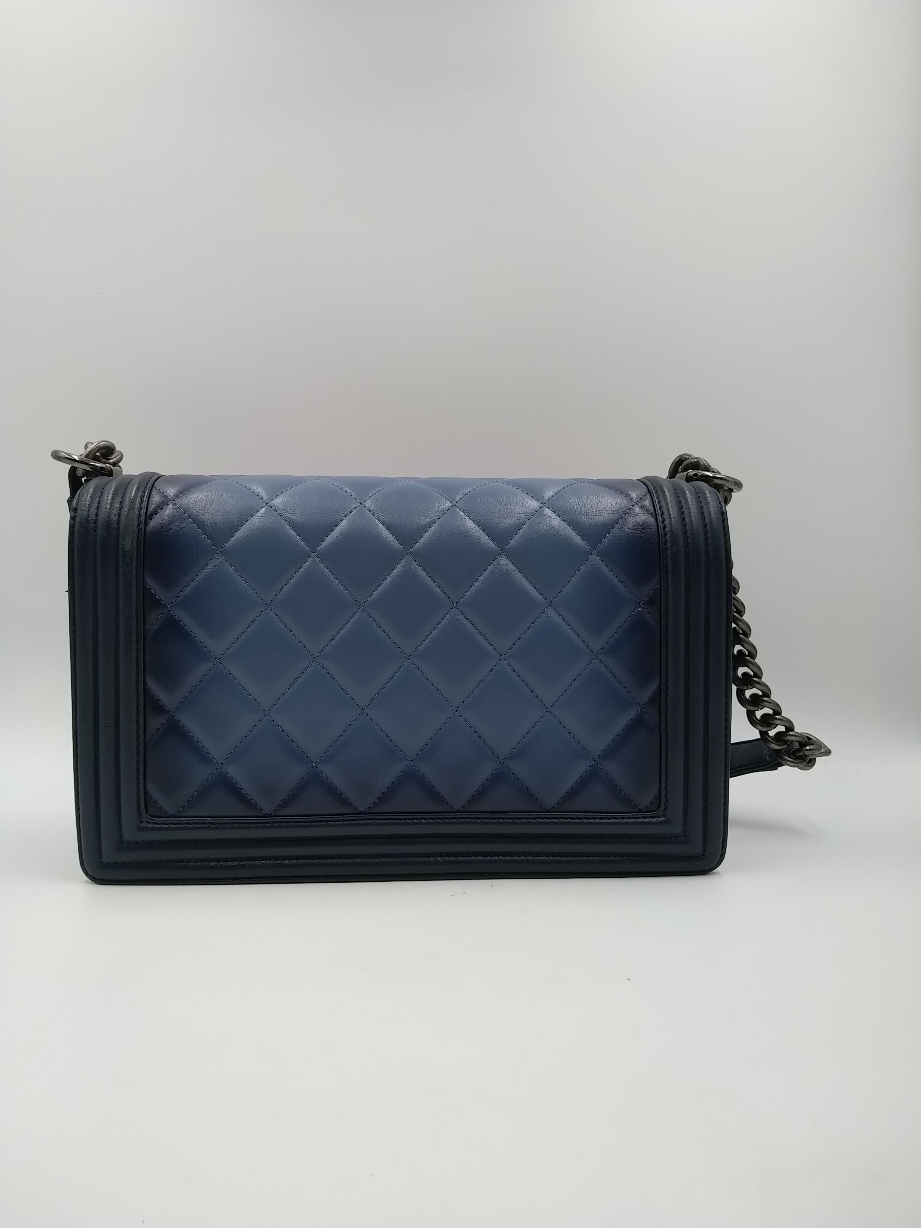 Chanel Blue Ombré Quilted Leather Boy Bag, 2015. This particular bag is the large size of the collection and features a long antique ruthenium chain-link strap with a leather pad that can be used as a long strap or looped around as a shoulder