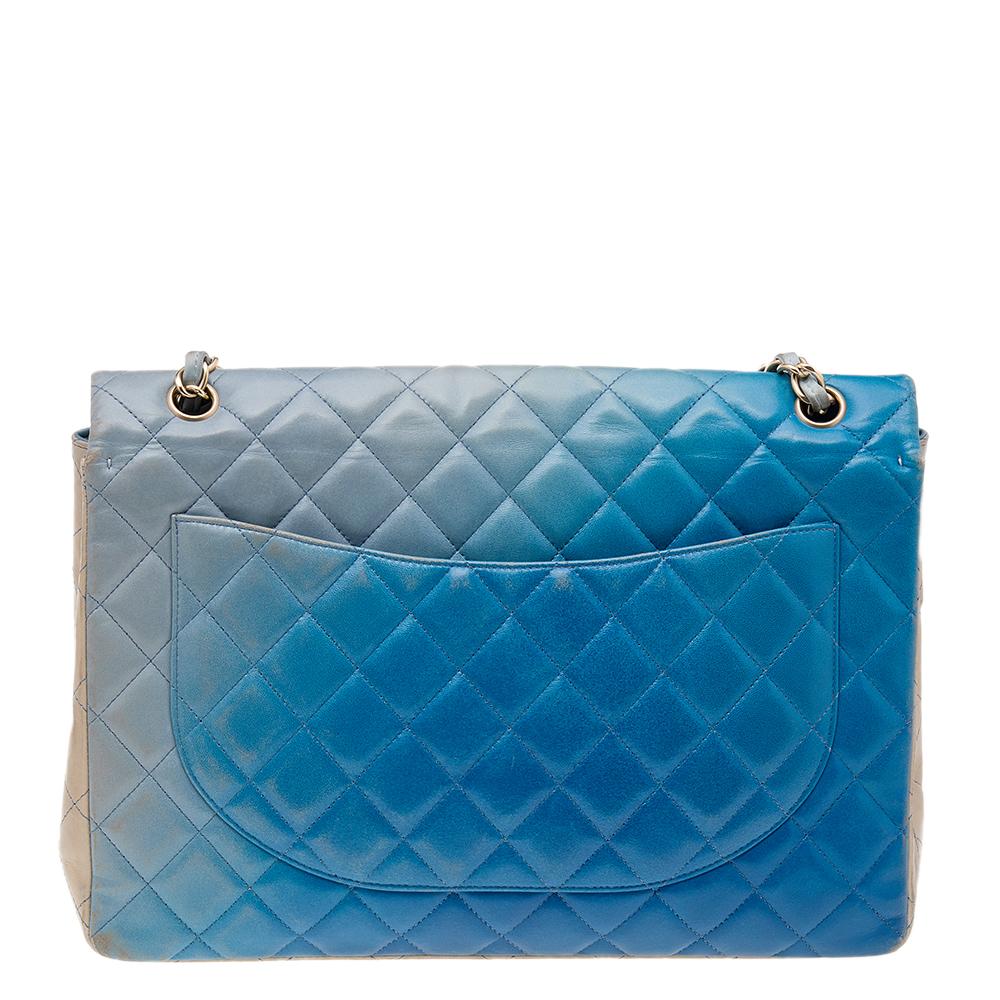 We're bringing Chanel's iconic Classic Flap bag to your closet with this beautiful blue ombre creation. Exquisitely crafted from quilted leather, it bears the signature label inside the leather interior and the iconic CC turn-lock on the flap. The