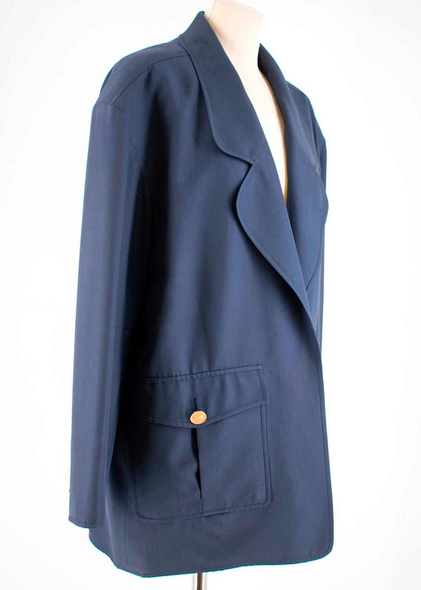 Chanel Blue Oversize Longline Jacket

- Gold Coco Chanel coin buttons
- One left breast pocket
- Two large pockets with gold buttons 
- Natural shoulder 
- Notch Lapel
- 2 Spare Gold buttons on inside 
Material 
Wool Silk blend (missing tag)

Made