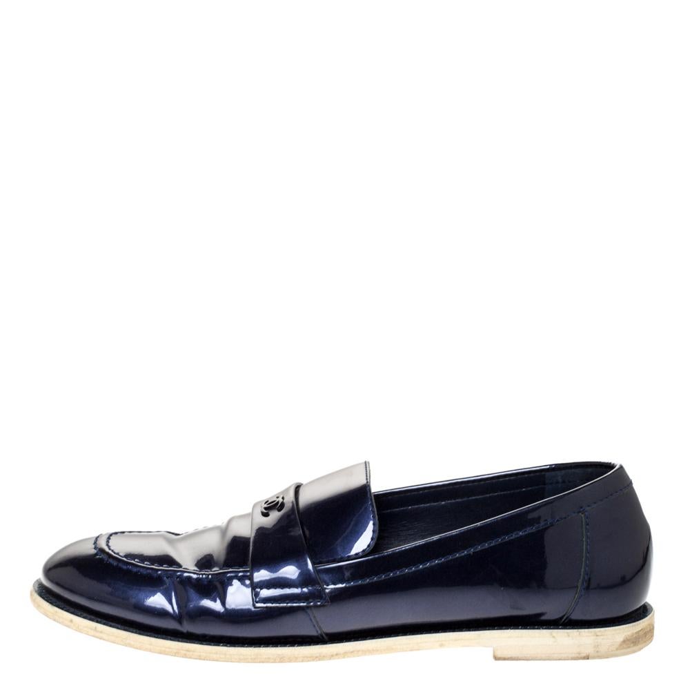 The beauty of these loafers lies in the comfort factor and the timeless CC logo on the glossy uppers. Made from blue-hued patent leather, these sleek loafers by Chanel are lined with leather and shaped to envelop your feet with bliss. They are