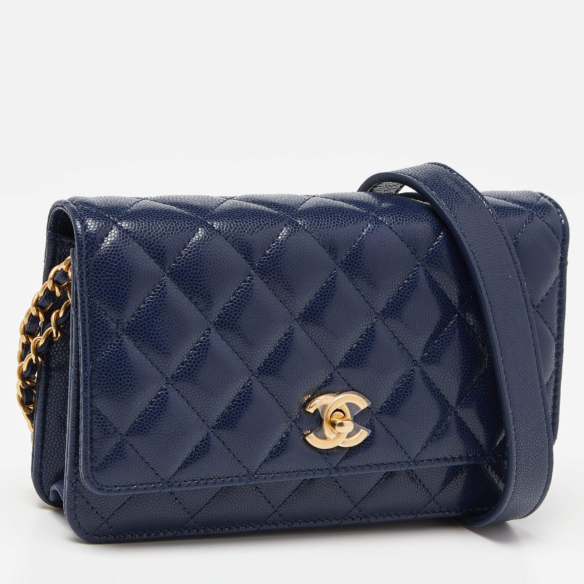 Trust this Chanel WOC to be light, durable, and comfortable to carry. Crafted from leather, it features a lined interior, a long chain strap, and the CC logo at the front.

