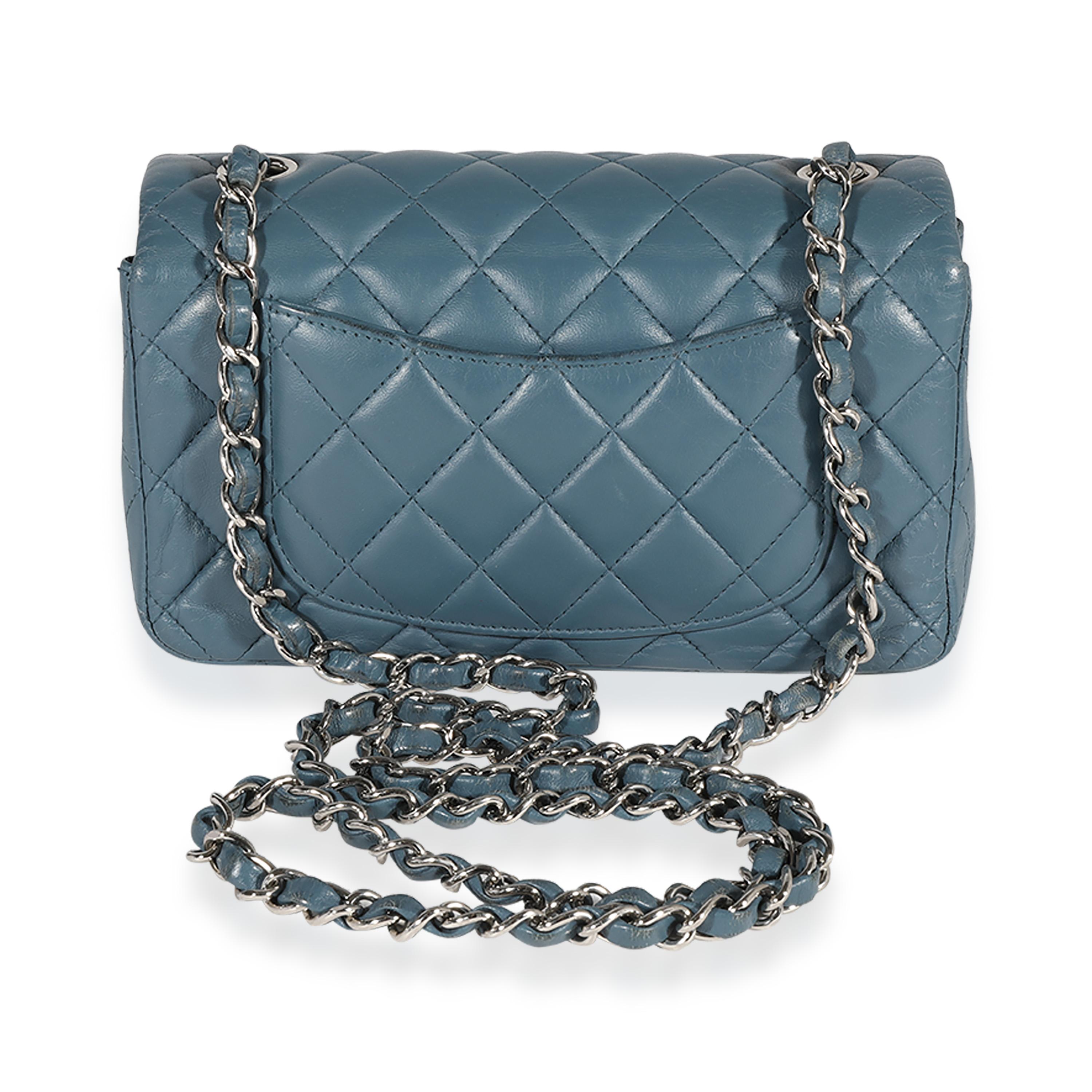 Listing Title: Chanel Blue Quilted Lambskin Mini Rectangular Classic Flap Bag
SKU: 123028
Condition: Pre-owned 
Handbag Condition: Very Good
Condition Comments: Very Good Condition. Heavy scuffing and wrinkling at corners and throughout exterior.