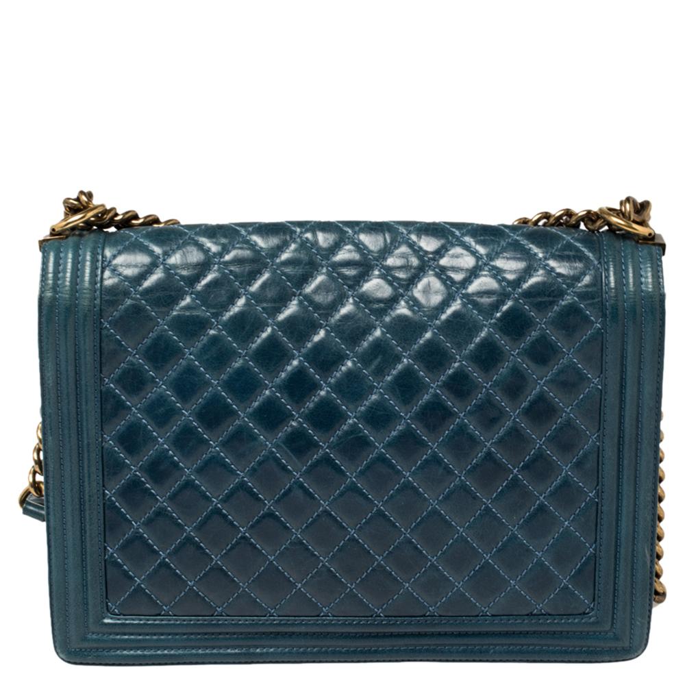 Every Chanel creation deserves to be etched with honor in fashion history as they carry irreplaceable style. Like this stunner, Boy Flap, that has been exquisitely crafted from quilted leather. It brings a blue shade and the iconic CC push lock on