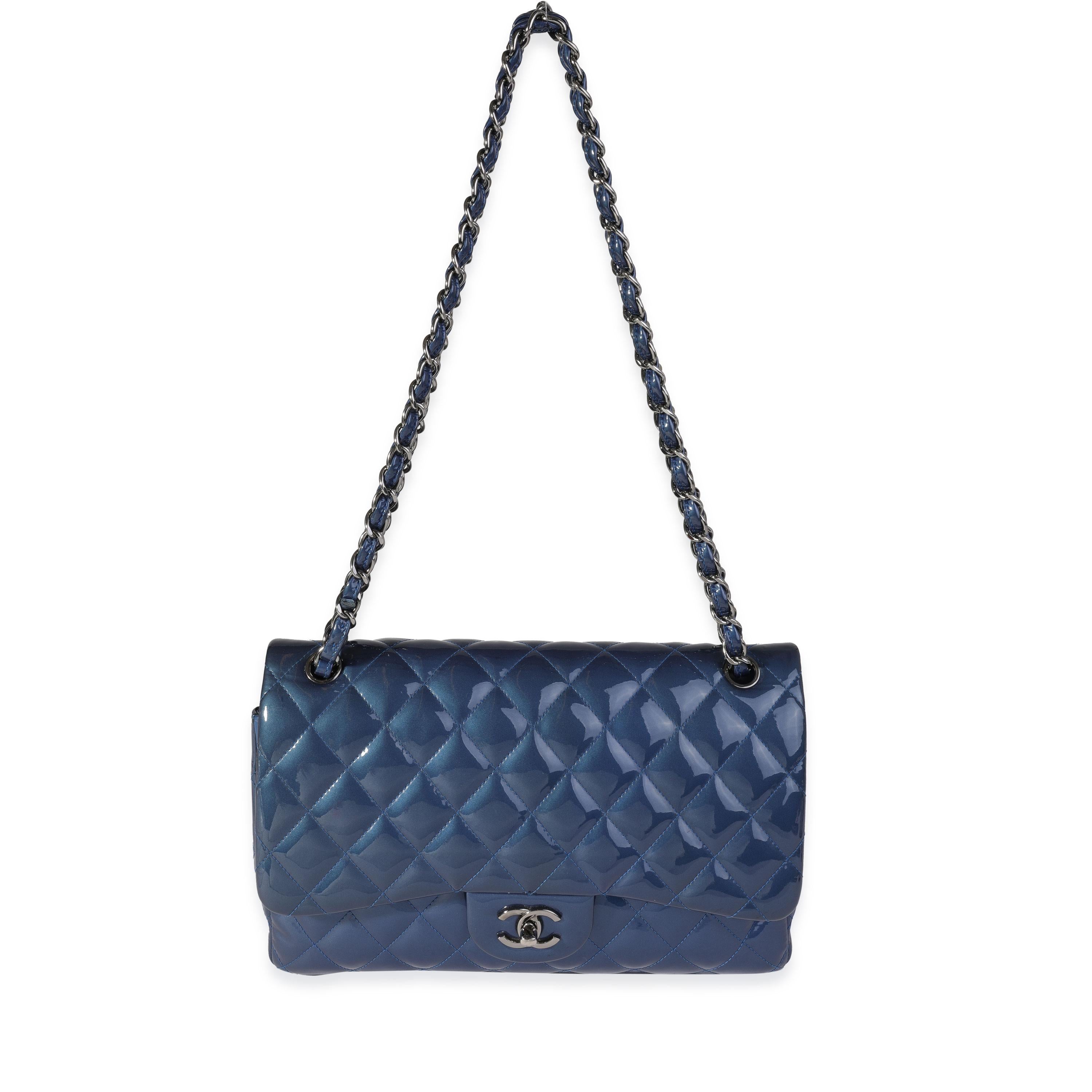 Listing Title: Chanel Blue Quilted Patent Leather Jumbo Classic Double Flap Bag
SKU: 121095
MSRP: 9500.00
Condition: Pre-owned 
Handbag Condition: Very Good
Condition Comments: Very Good Condition. Light marks to patent leather. Scratching to