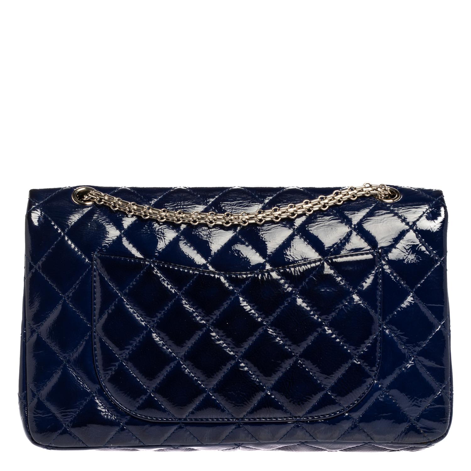 Chanel's Flap Bags are iconic and noteworthy in the history of fashion. Hence, this Reissue 2.55 is a buy worth the splurge. Exquisitely crafted from blue patent leather, it bears their signature quilt pattern and the iconic Mademoiselle lock on the