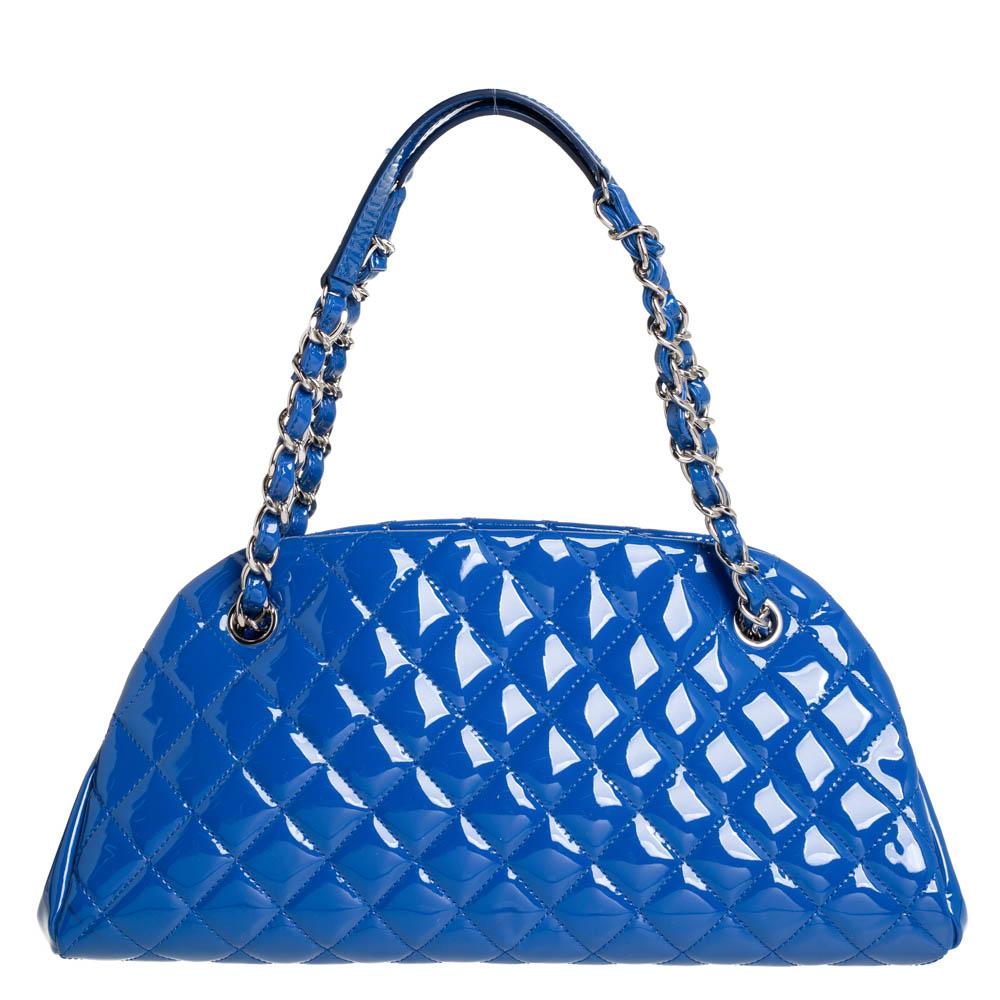 Spacious and captivating, this Just Mademoiselle Bowler bag is from Chanel. It has been crafted from quilted patent leather and features a lovely shape and design. It is equipped with two chain handles and well-sized fabric compartments to keep your