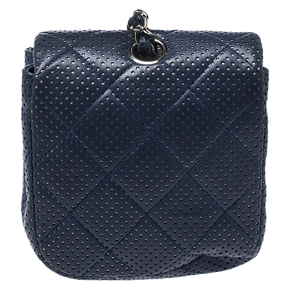 A stylish option for everyday use or special events is this bag from Chanel. It is crafted from blue perforated quilted leather and features the signature chain and leather interwoven strap. The CC lock closure opens to leather-lined interior that