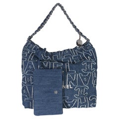 Chanel Blue Quilted Washed Denim Logo Embroidered Medium Chanel 22 Hobo