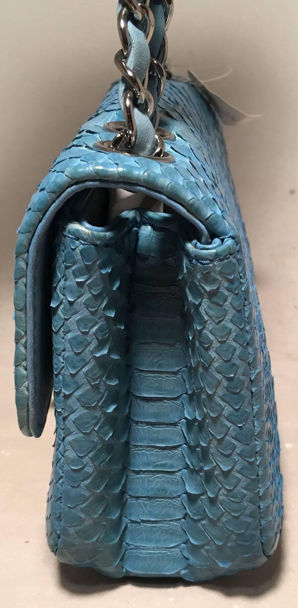 Chanel Blue Snakeskin Python Mini Classic Flap Shoulder Bag in excellent condition.  Blue snakeskin exterior trimmed with silver hardware and signature woven chain and leather shoulder strap.  Front CC Logo twist closure opens via single flap to a