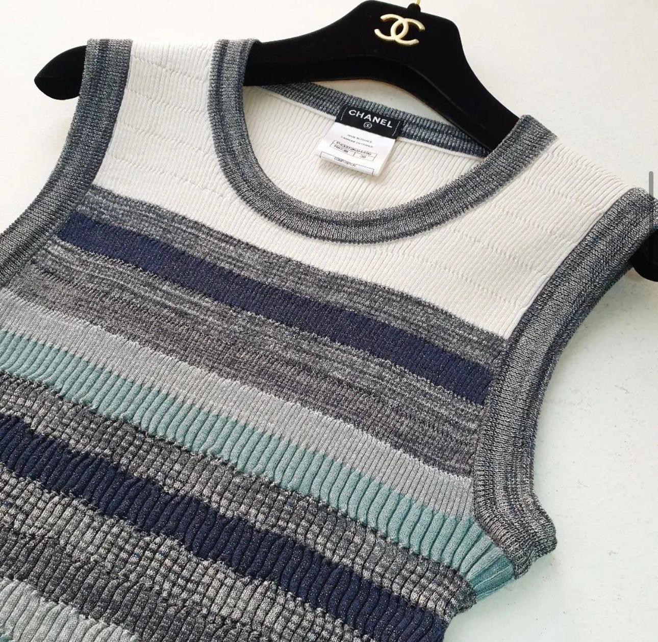 Chanel gradient blue tank top. Shades of grey, blue, silver and navy in a stripe pattern. Stretchy material. 

Designer size 38.

Fabric: 57% Cotton, 20% Viscose, 14% Nylon, 7% Polyester, 2% Cashmere

Very good condition