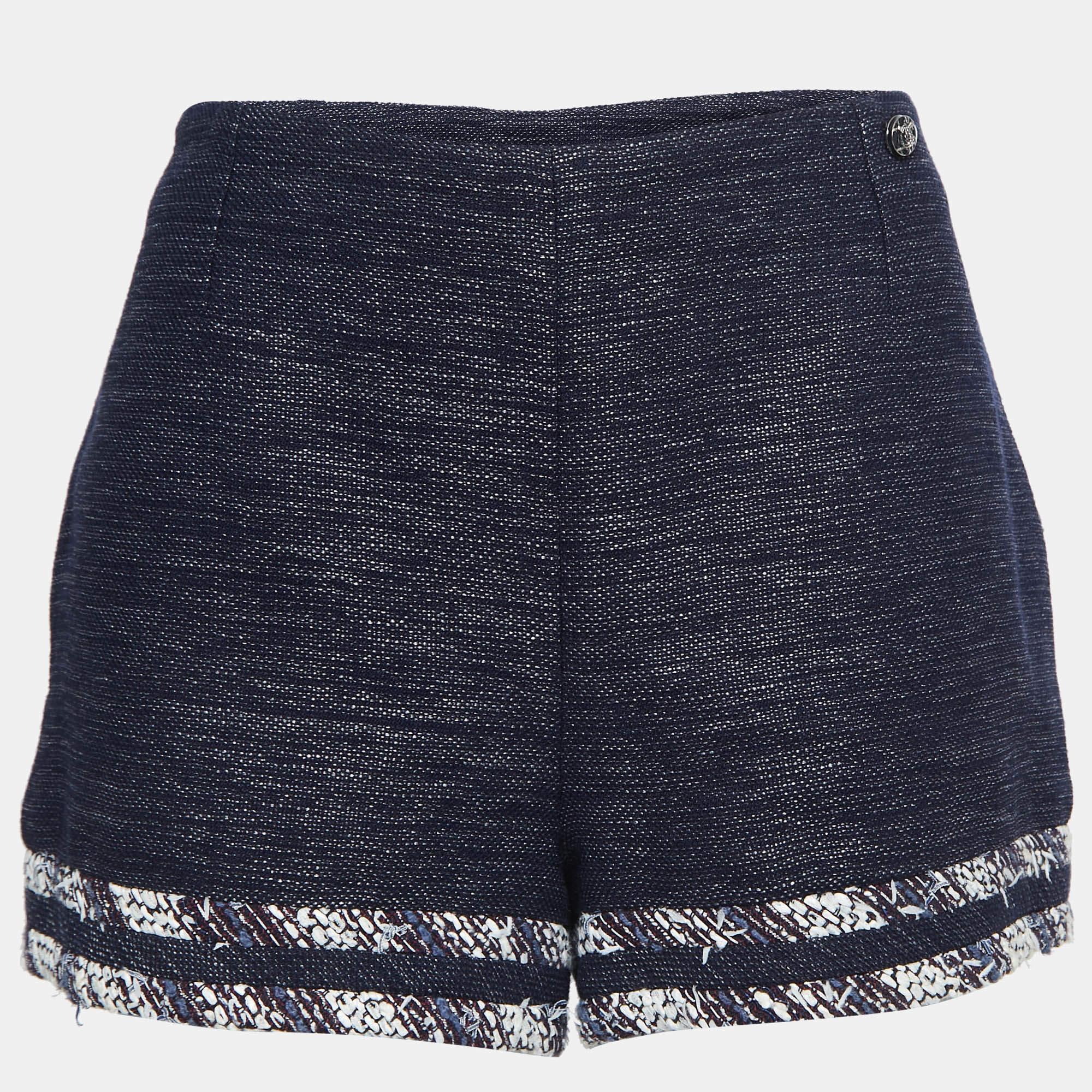 These delightful shorts by Chanel are a must-have addition to your wardrobe. They have a tweed finish and a zip closure. Team them with a statement top and pumps for an evening out.


