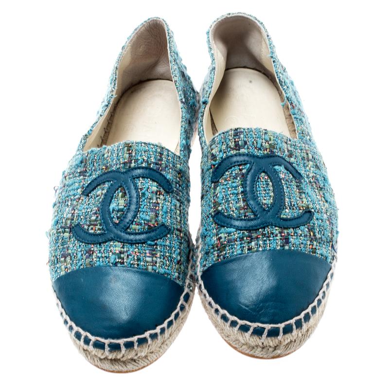 Espadrilles are not just stylish, but also comfortable and easy to wear. This lovely pair from Chanel will accompany a casual outfit with perfection. They are made of blue tweed fabric and detailed with leather cap toes and the CC logo on the