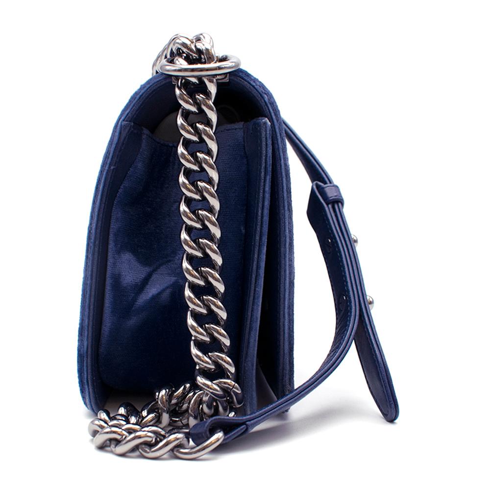 Chanel Blue Velvet Small Boy Bag

gunmetal hardware
Leather and hardware chain strap (can be worn two ways)
Quilted detail on outside
Interior and pouches in good condition
Chanel logo at clasp

This bag can be viewed at our HEWI London offices.