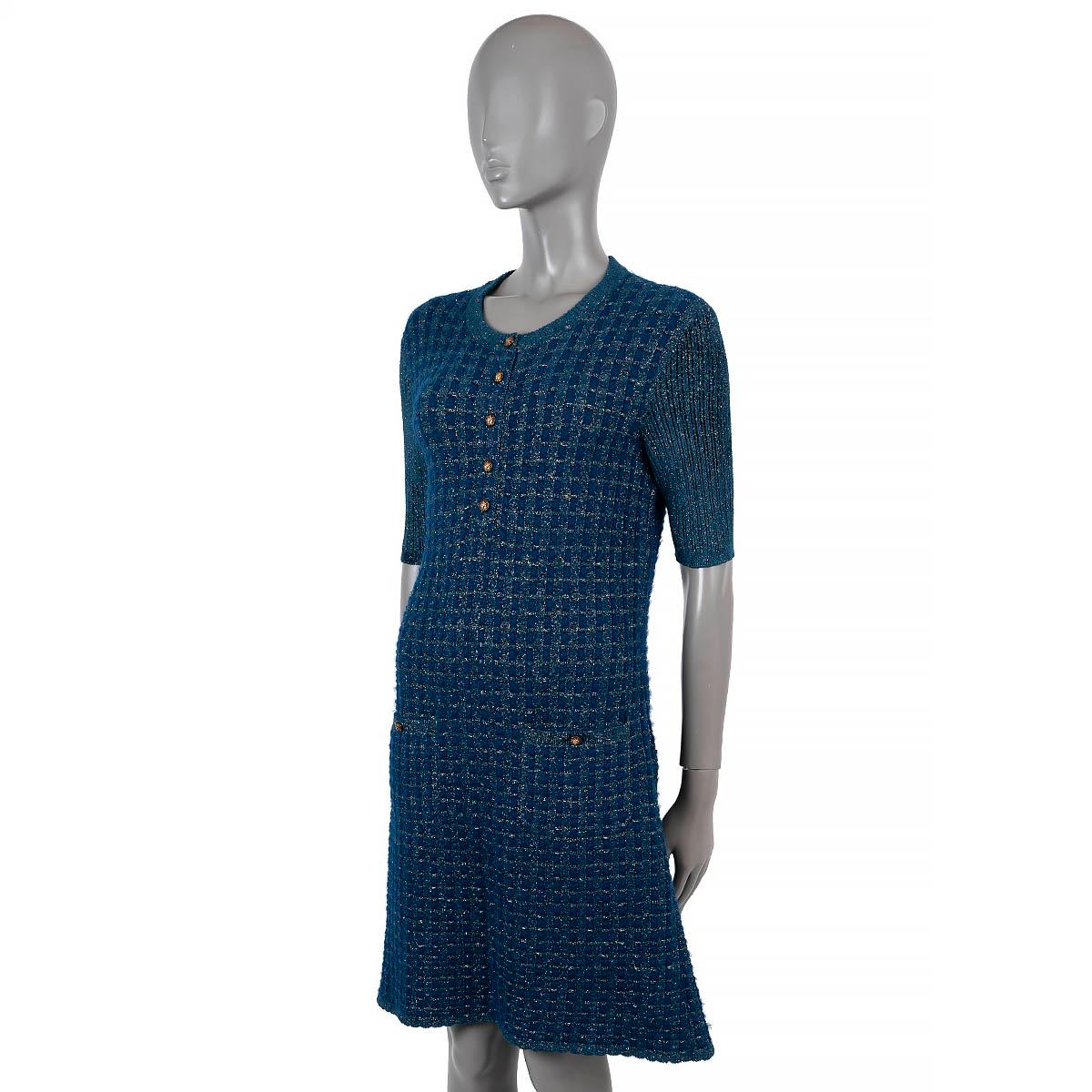 100% authentic Chanel lurex tweed dress in petrol blue and gold viscose (66%), polyester (22%), nylon (6%), mohair (4%) and wool (2%). Features short rib-knit sleeves, a crewneck and two buttoned patch pockets at the waist. Closes partially with