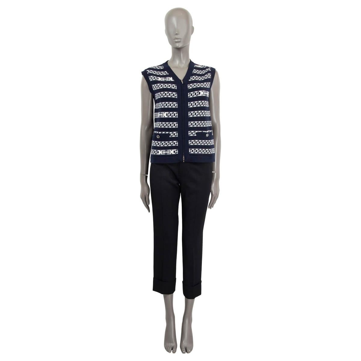 100% authentic Chanel sleeveless knit vest in navy and white cashmere (100%). Features two sewn shut 'CC' buttoned patch pockets on the front. Opens with two 'CC' zippers at the front. Unlined. Has been worn and is in excellent condition. Matching