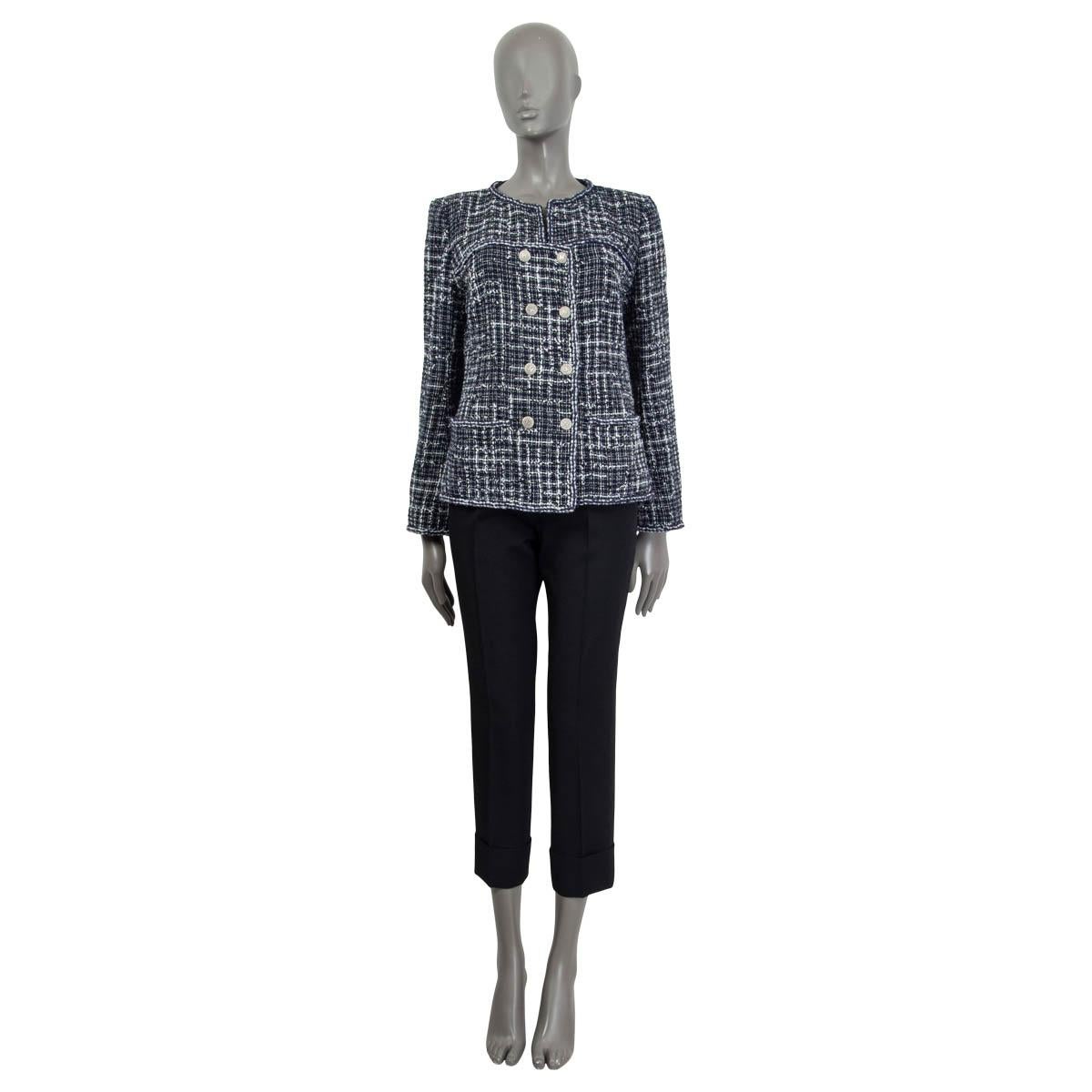 100% authentic Chanel 2014 double-breasted tweed jacket in midnight blue and white cotton (60%), nylon (20%), acrylic (14%) and polyester (6%). Features two slit pockets on the front and buttoned cuffs. Opens with five buttons on the front. Lined in