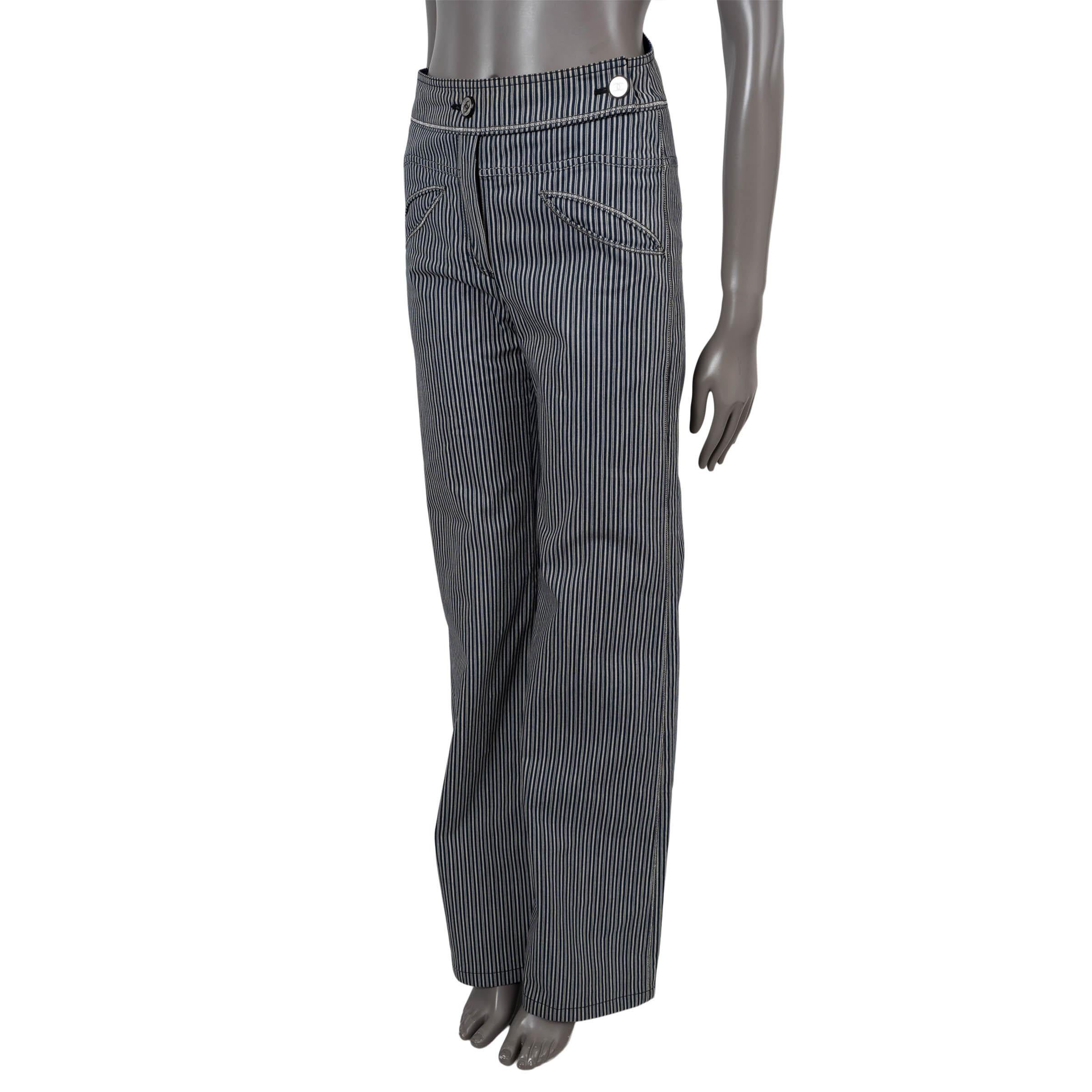 100% authentic Chanel striped wide-leg jeans in grey and navy denim cotton (with 5% polyurethane) Feature silver thread stitching along the seams and around the pockets, two front and two back pockets with CC embroidery. Open with a concealed zipper