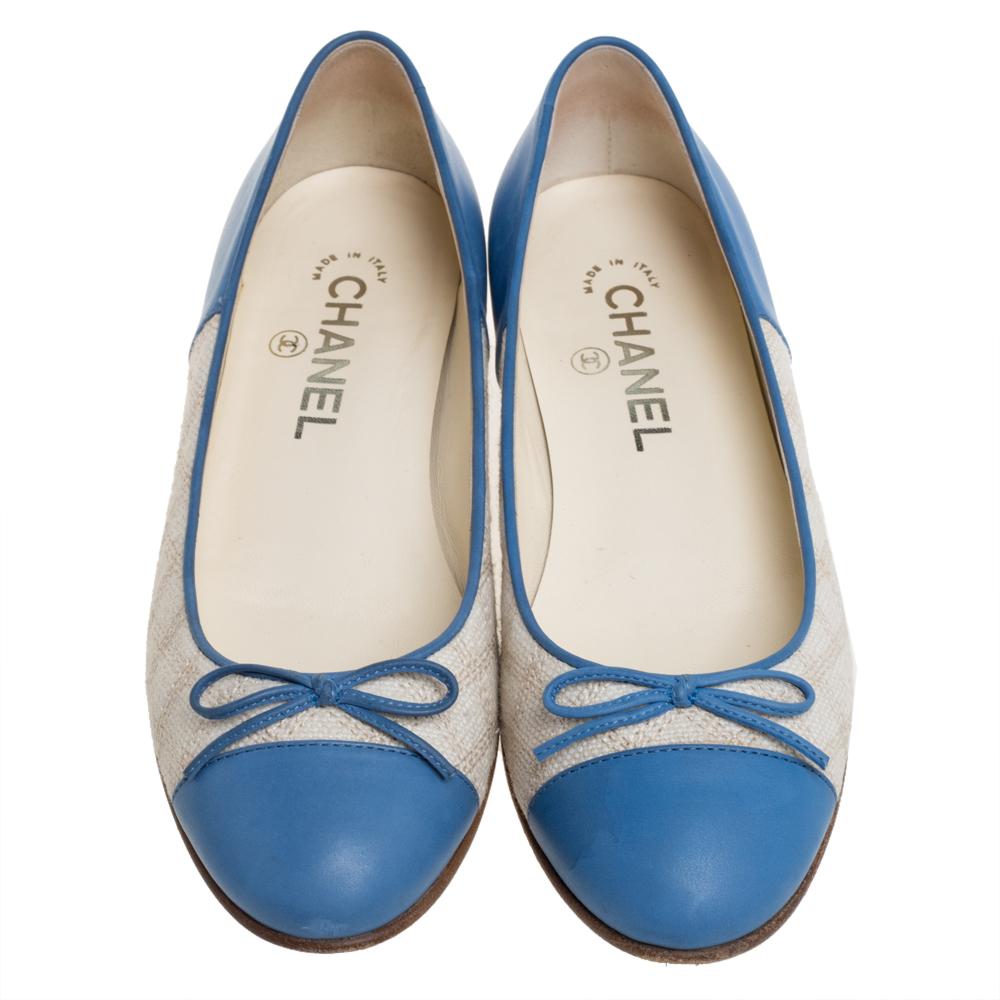Endless compliments will come your way every time you wear these Chanel ballet flats. The blue and white flats are crafted from leather and canvas and styled with cap toes and delicate bows on the uppers. They flaunt the iconic CC logo detailed on