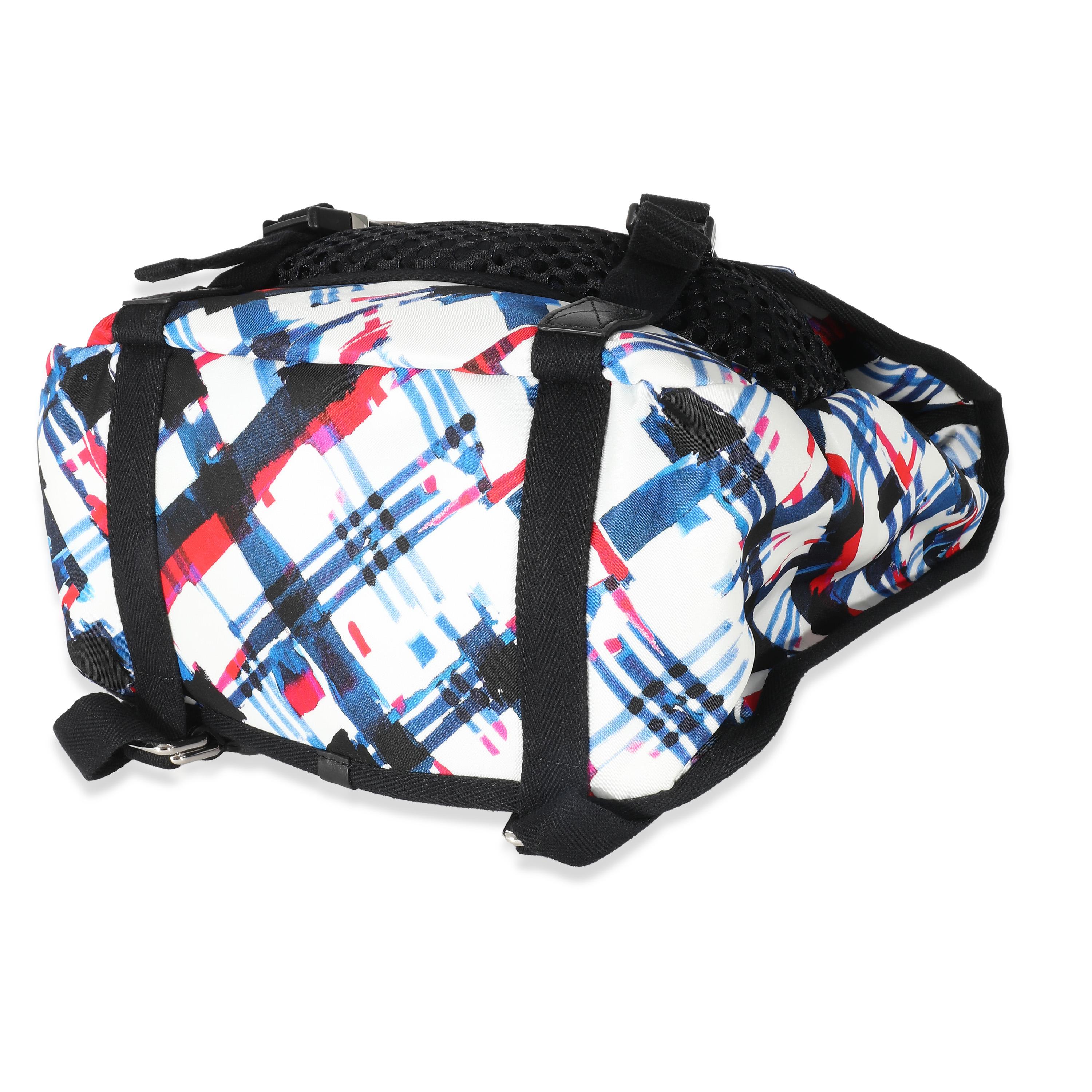 Listing Title: Chanel Blue White Red Nylon Airline Backpack
SKU: 136985
MSRP: 2600.00 USD
Condition: Pre-owned 
Handbag Condition: Excellent
Condition Comments: Item is in excellent condition and displays light signs of wear.Faint exterior