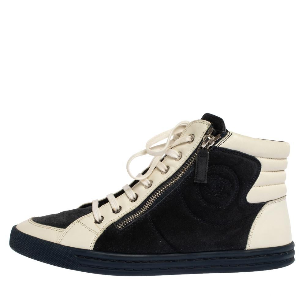 Flaunt your high-style with these luxurious sneakers from Chanel! They've been carefully crafted from suede and leather and designed with lace-up vamps, CC logo on the sides, and twin zipper accents in silver-tone. You are sure to receive both