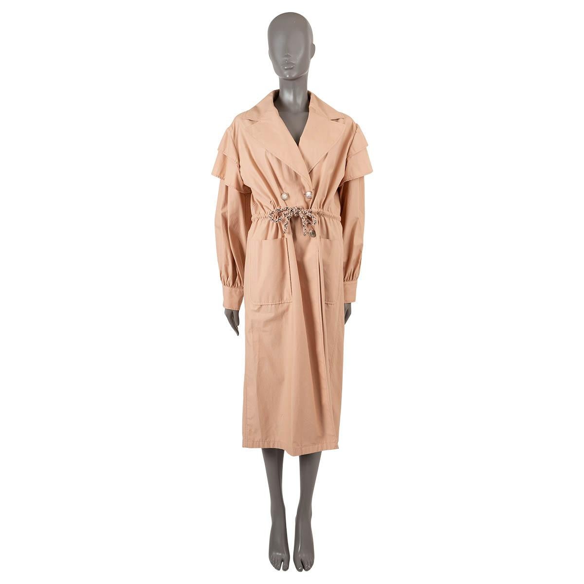 100% authentic Chanel double-breasted trench coat in blush pink cotton (100%). Features ruffled shoulders, peak lapels, drawstring waist and two patch pokcets on the front. Closes with CC buttons on the front. Unlined. Has been worn and is in
