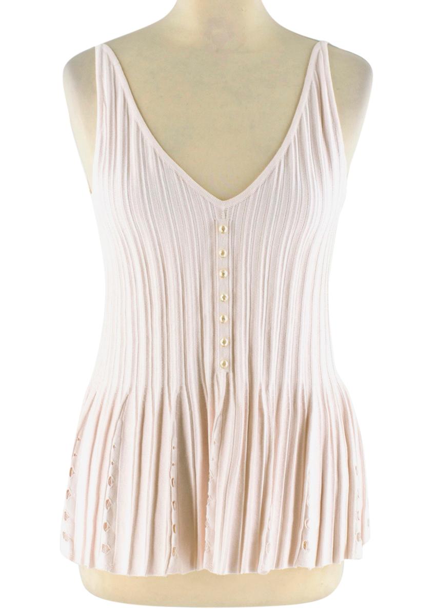 Chanel Blush Pleated Knit Twinset 

- Cotton Blend 
- Pink Knit 
- Perforated Design 
- CC Buttons 

Cardigan
- 4 External Pockets 
- Long Sleeves
- CC Buton Detail

Top 
- Sleeveless
- Front Button Detail 
- Fluted Hemline 
- Perforated Detail 
- V