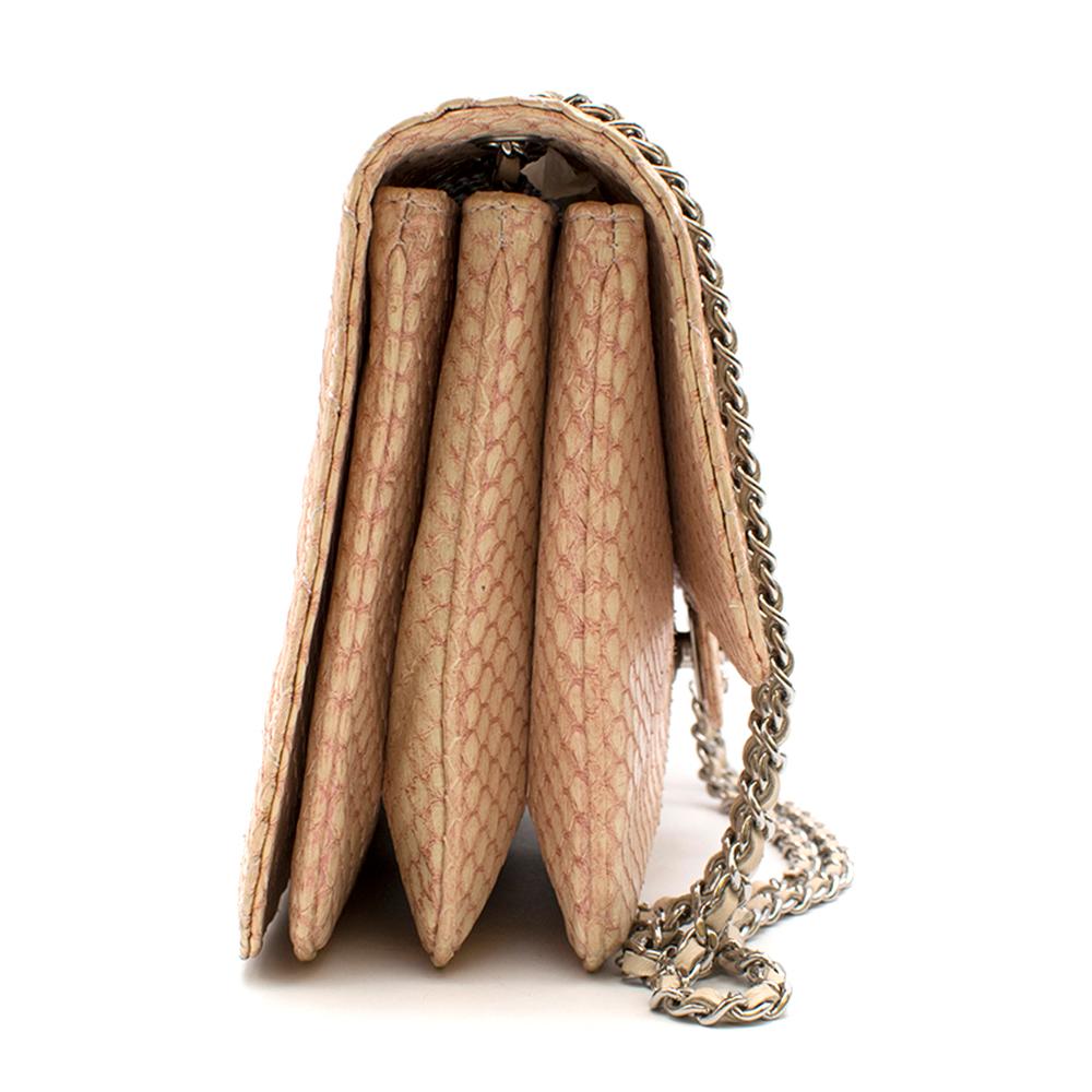 Chanel Blush Quilted Python 3 Accordion Square Flap Bag

Quilted, snakeskin embossed leather
Silver hardware
Braided hardware and leather chain
Strap can be worn at two lengths
Expandable width
Interior pockets all in good condition
Pale blush body