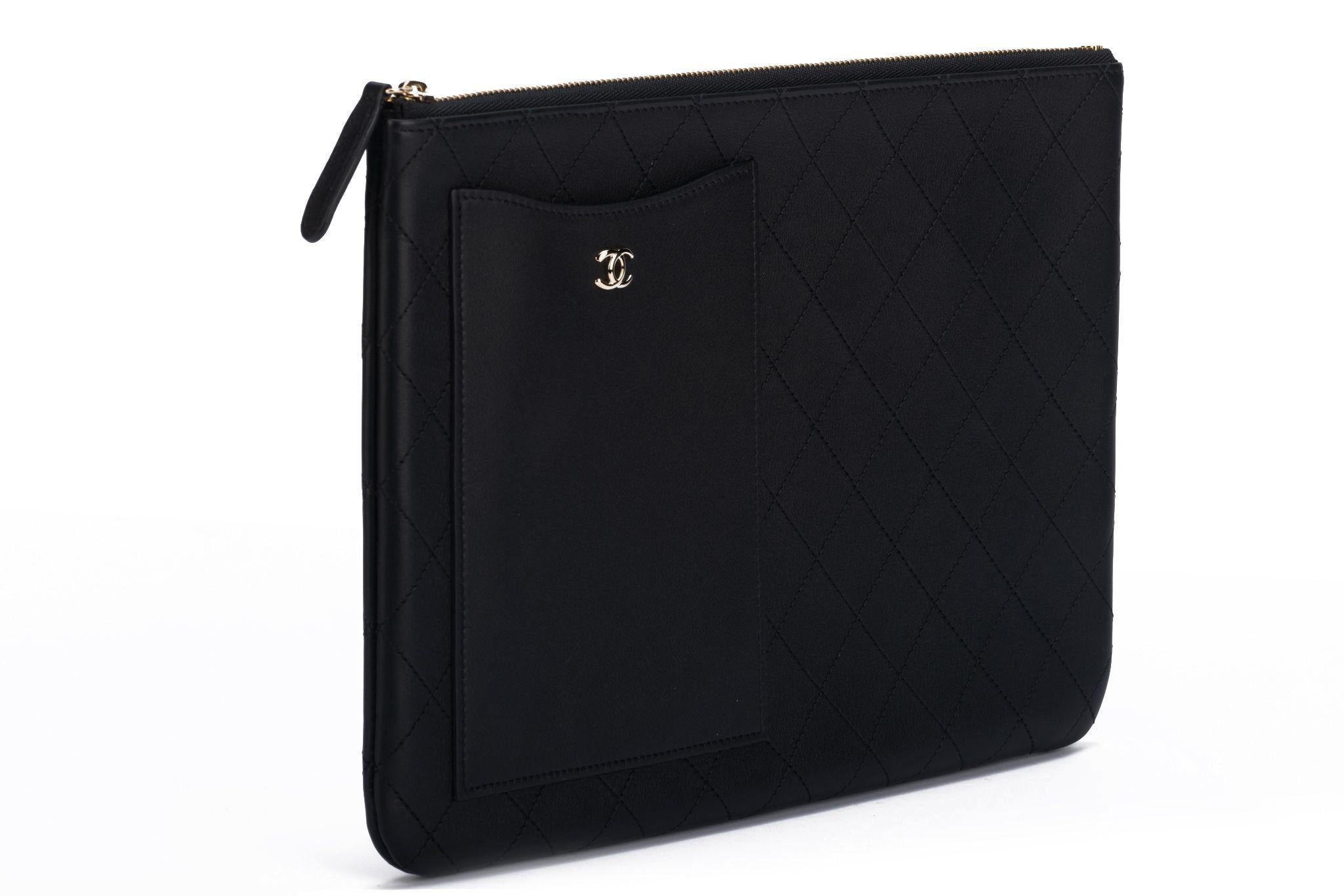 Chanel new black Lambskin quilted leather clutch. Gold tone hardware. Collection 28. Comes with hologram , ID card, original dust cover and box.