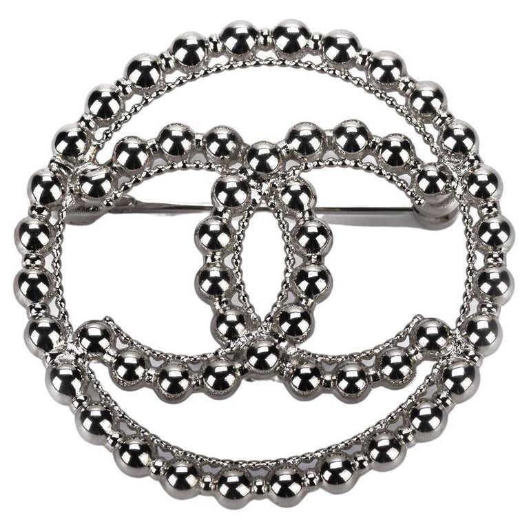 silver chanel pin