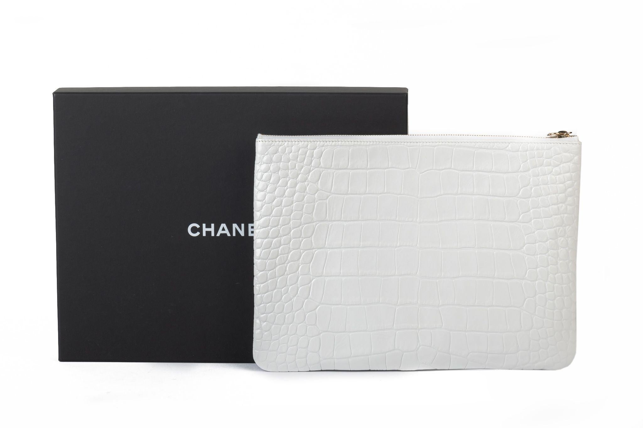 Chanel brand new white croc print clutch with gold writing. Collection 28. Comes with hologram, ID card, booklet, dust cover, box and ribbon.