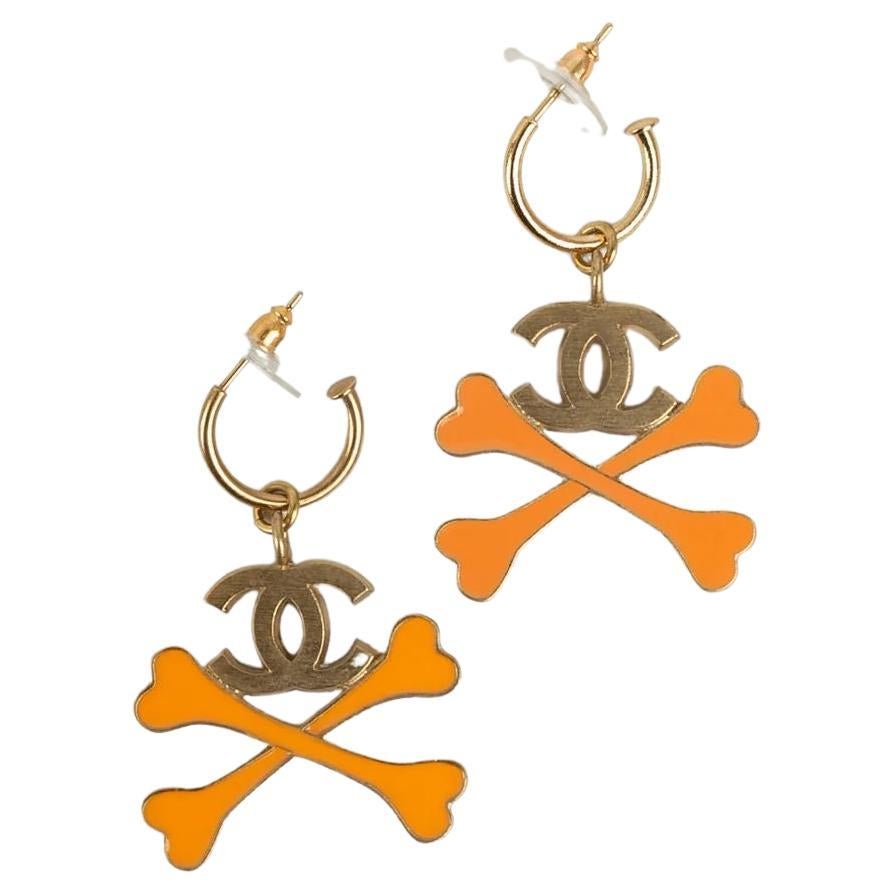 Chanel "Bones" Earrings in Gold Metal with Orange Enamel For Sale