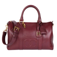 CHANEL - Sac Boston 35 vintage intemporel en cuir caviar bordeaux
