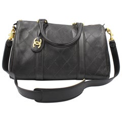 Chanel Boston handbag in black leather – travel bag