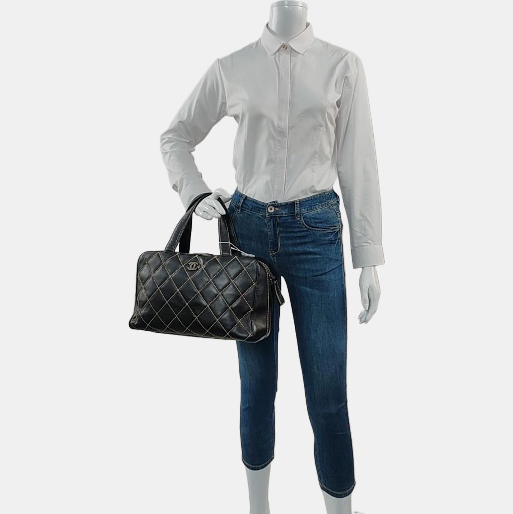 Chanel Boston Wild Stitch Black Top Handle Zip Opening Bag
These are professional photos of the actual bag offered by Luxbags.
Condition: VERY GOOD.
Overall moderate signs of use. Scratches on leather and hardware. Light stains on the inside and
