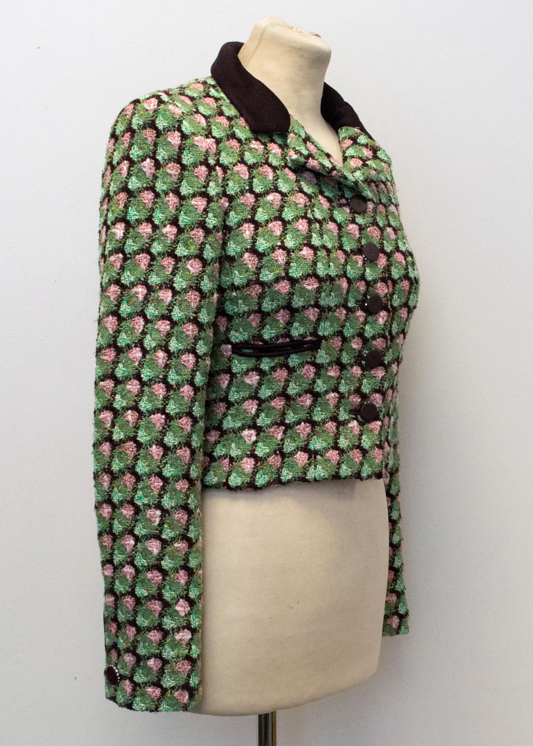 Chanel boucle green, pink and brown jacket. Long sleeved, two faux front pockets and button fastening. Chain weight on the interior of the jacket. 

Please note: couple of the crystals missing from one button, see images.

Please note, these items