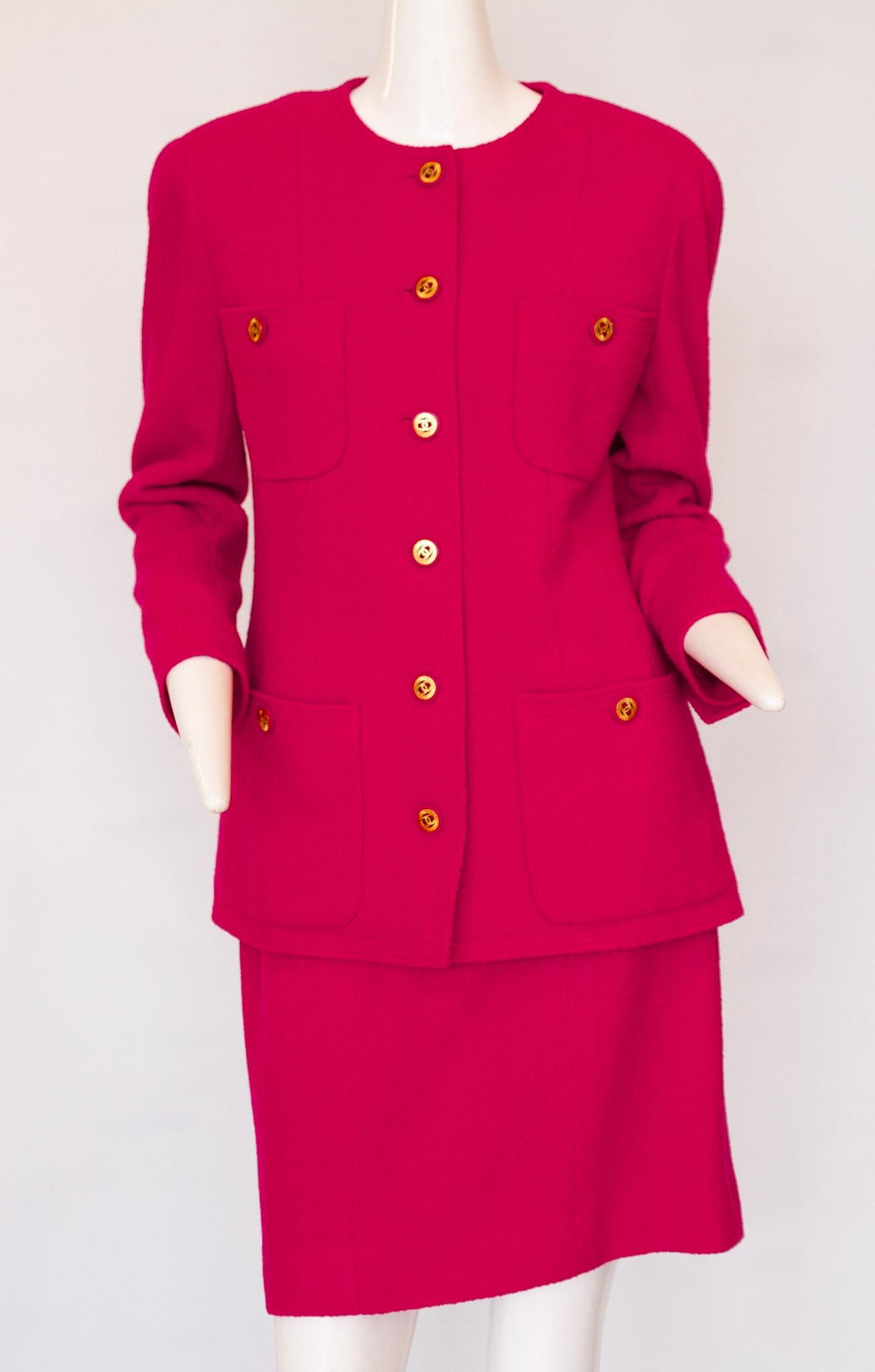 Chanel fuscia or hot pink jacket and skirt ensemble. 