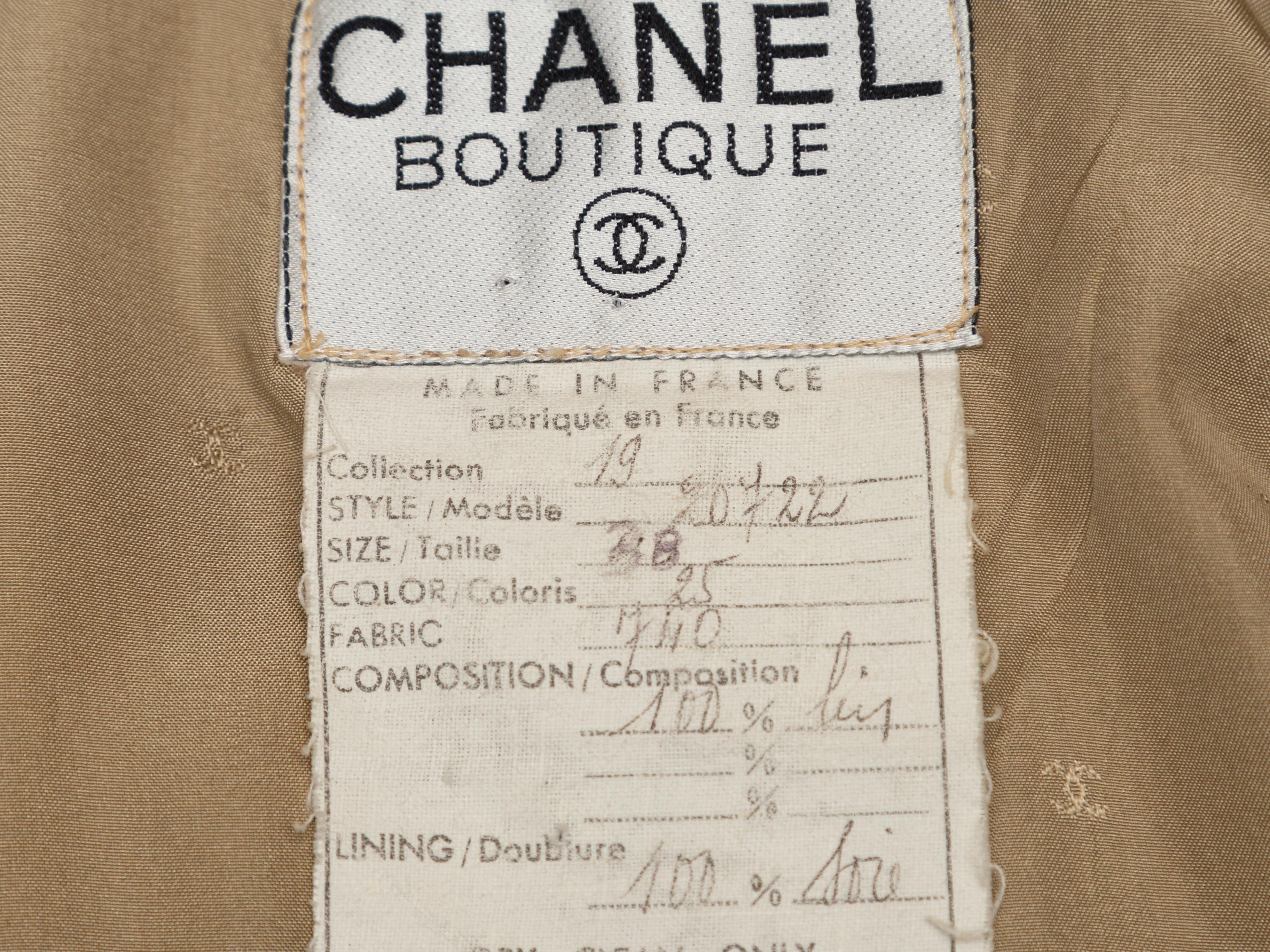 Product details: Vintage beige linen blazer by Chanel Boutique. Shawl collar. Dual hip pockets. Button closure at front. Designer size 38. 34