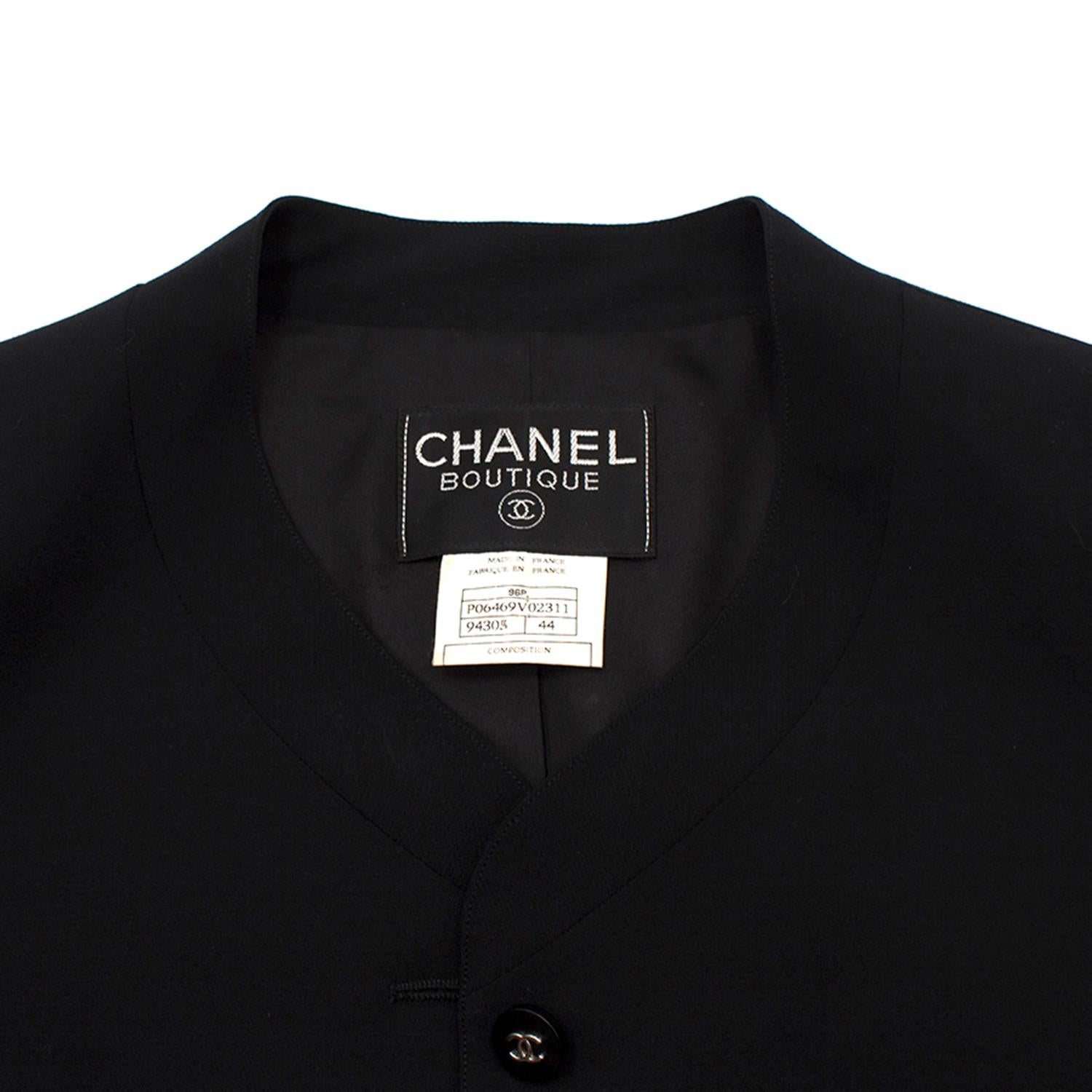 Chanel Boutique Black Lightweight Wool Blazer 

- 100% wool
- Lightweight
- 100% silk lining with CC embroidery
- Button front fastening
- Button-up cuffs
- Black plastic buttons with silver-tone CC embossed
- 4 welt pockets
- Collarless
- Padded