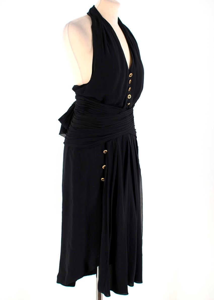 Chanel Boutique Black Silk Pleated Halterneck Dress

-Classic chanel style
- Halterneck button closure
- Low back and V Neck
- Zip & Button closure at the back
- Pleated with a draped loose fit skirt
- Bow tie waist
-Gold button detail

Approx in