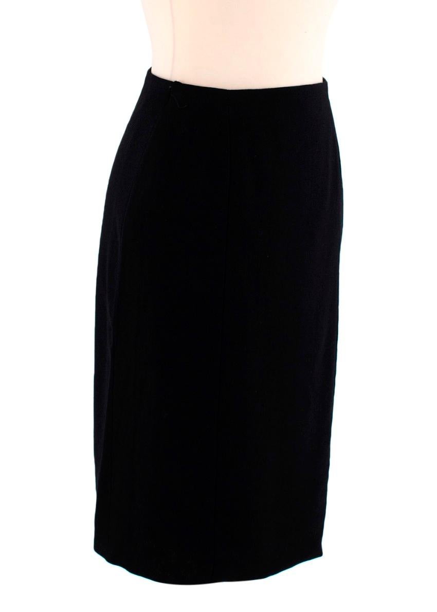 Chanel Boutique Black Wool Crepe Pencil Skirt

- Black wool crepe pencil skirt
- Concealed back zip closure finished with a decorative button
- Fully lined with silk fabric

Materials:
100% Wool
Lining - 100% Silk

Made in France
Dry clean