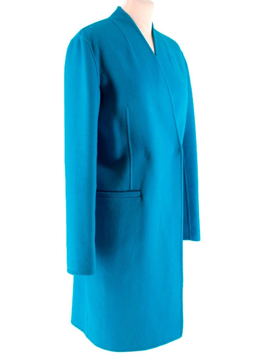 Chanel Boutique Blue Mid-length Coat

- Soft material
- Collarless
- Wrap over coat
- Two snap button closures
- Two front pockets
- Mid weight
- Grey tone metal chain for hook on
- No lining

Material
- Wool blend
(no care label)
- Dry clean