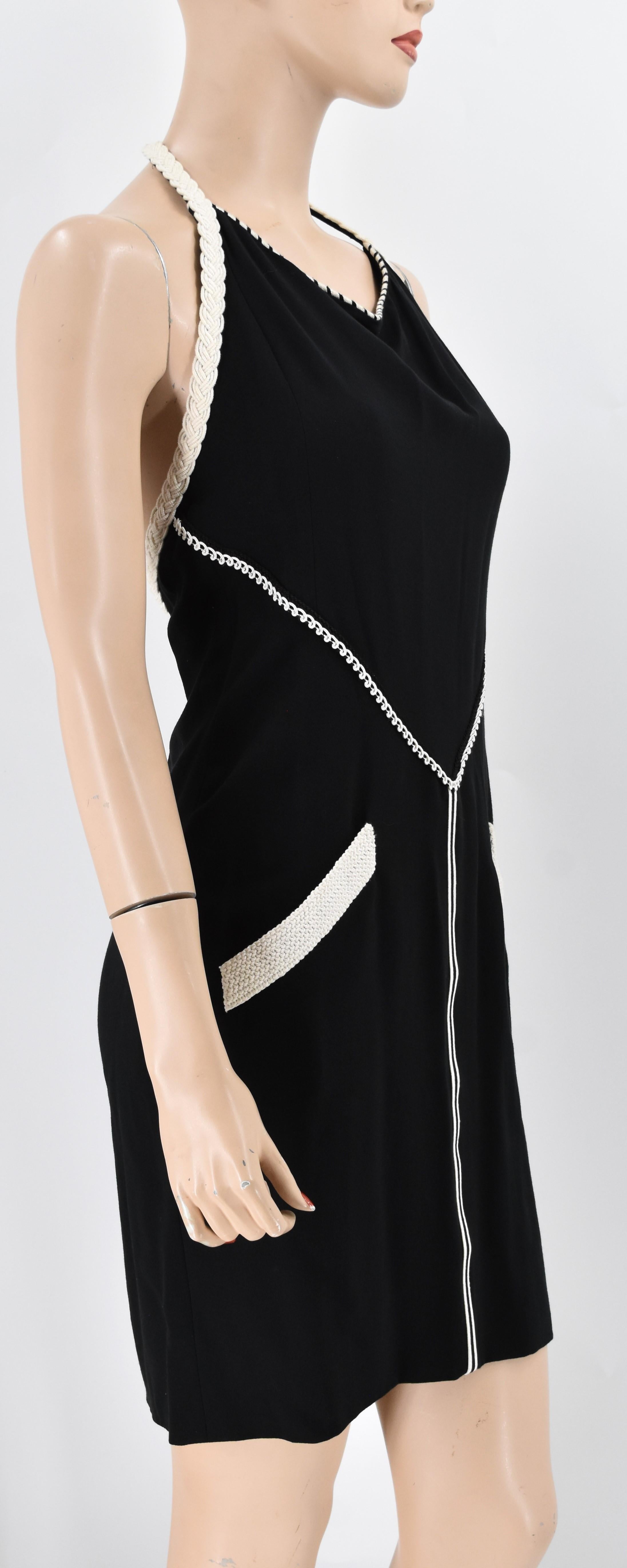 Chanel Boutique vintage halter dress adorned with braided trim throughout. It is in excellent condition. Color is beautiful blend of black and white.