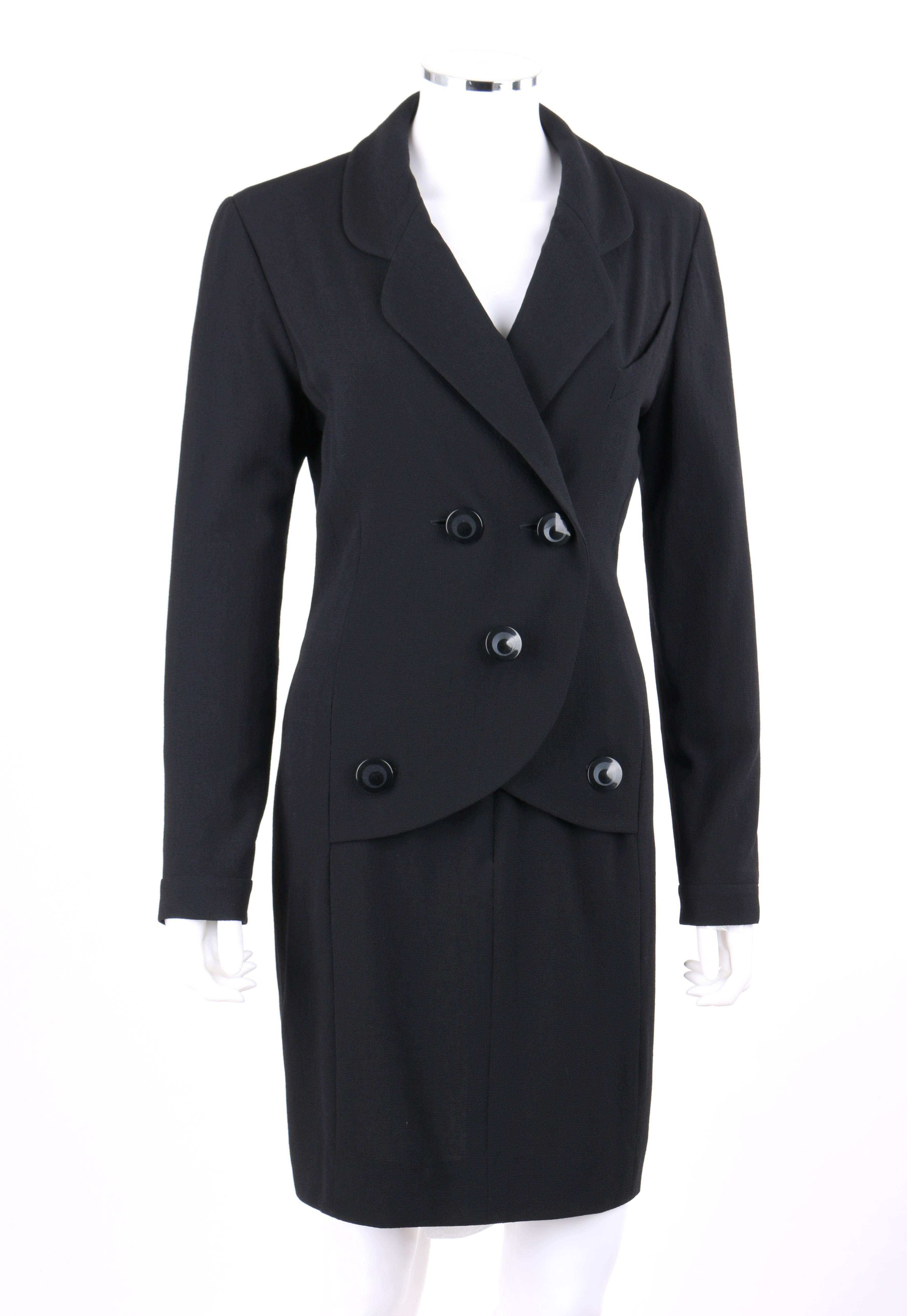 Chanel Boutique c.1980's black wool crepe double breasted one piece dress suit. Designed by Karl Lagerfeld. One piece mock blazer and pencil skirt dress suit. Rounded notched lapel collar. Long sleeves with single button closure at cuff. Five front