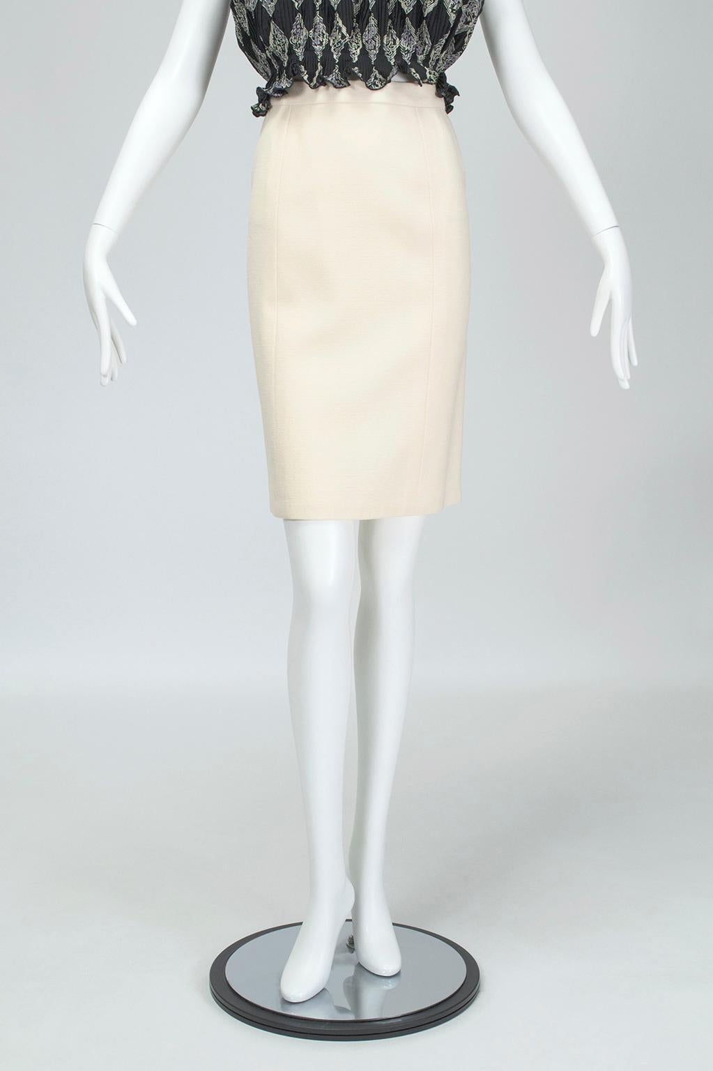 A go-with-everything wardrobe work horse in gently textured wool. Shapely enough to be sexy while still permitting a comfortable stride.

Ivory 7-panel skirt of lightly textured wool; 1 ¼” plain waistband and gentle A-line shape. Hidden zipper