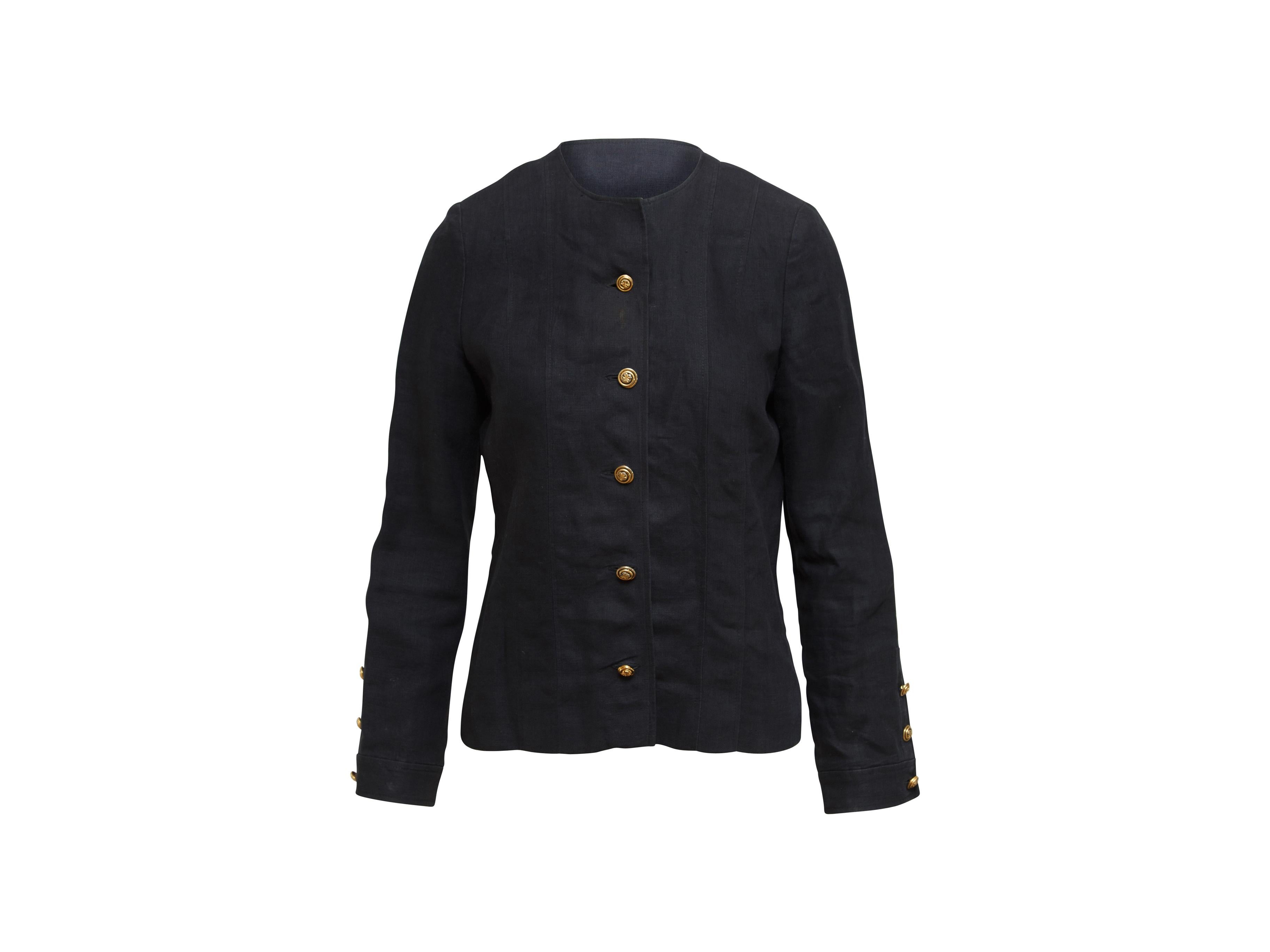 Product details:  Navy blue linen jacket by Chanel Boutique.  Crewneck.  Long sleeves.  Three-button cuffs.  Button-front closure.  36