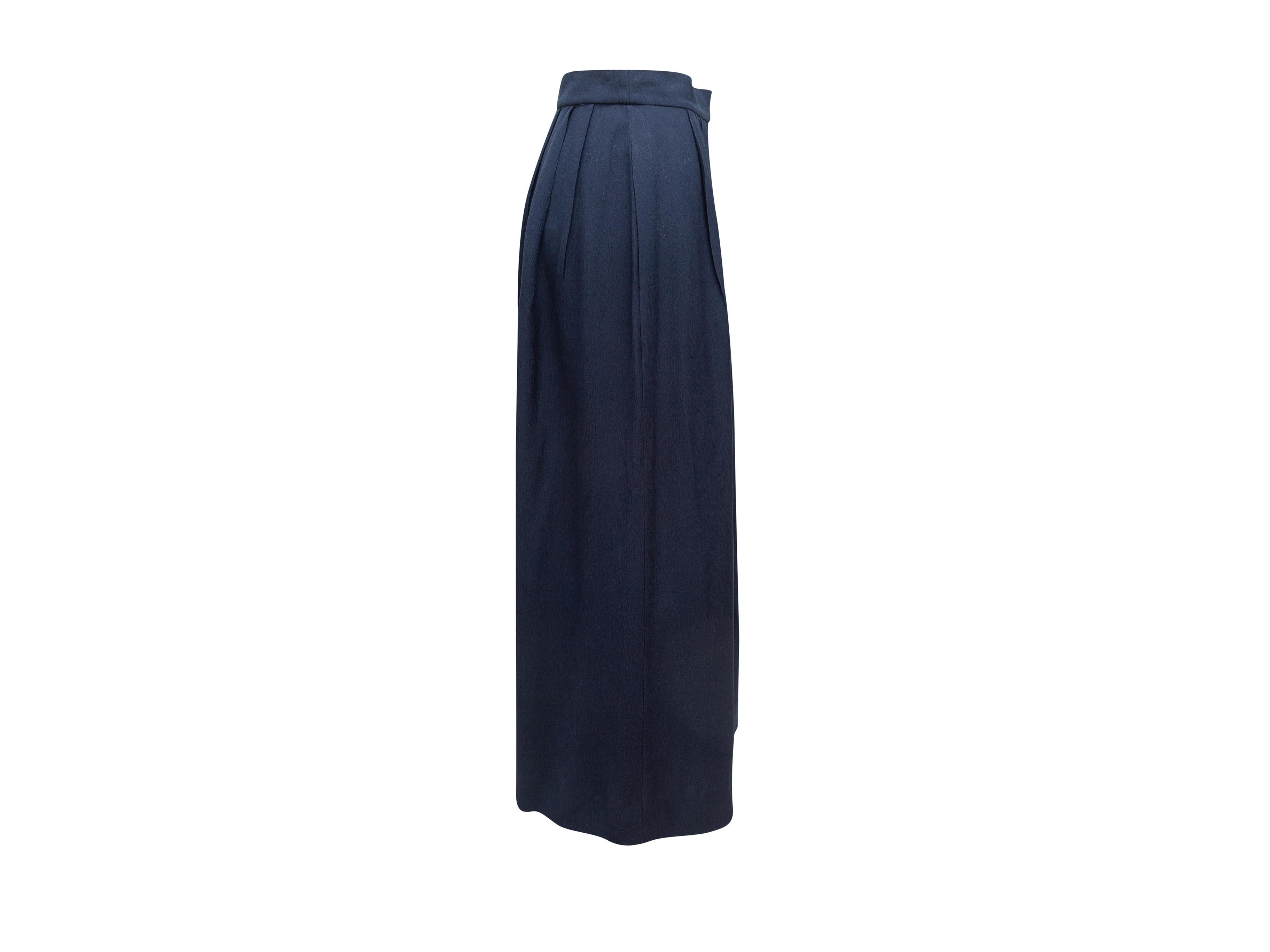 Product details: Vintage navy blue wide-leg culottes by Chanel Boutique. Gold-tone button closure at hip. 29