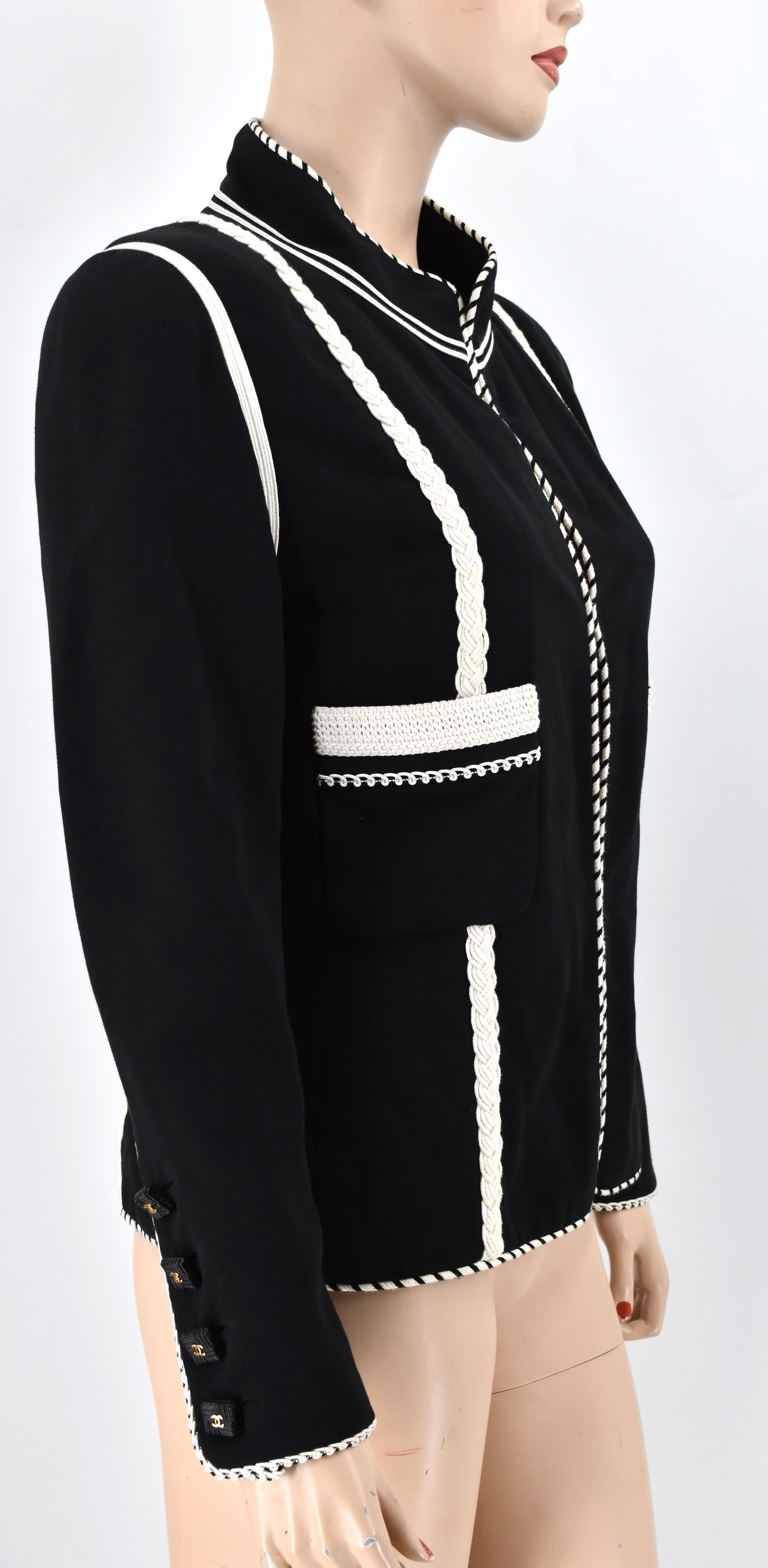 Chanel Boutique Runway Jacket in beautiful blend of black and white braided trim. It is adorned with Chanel interlocking Cc logo buttons. This is in excellent condition.