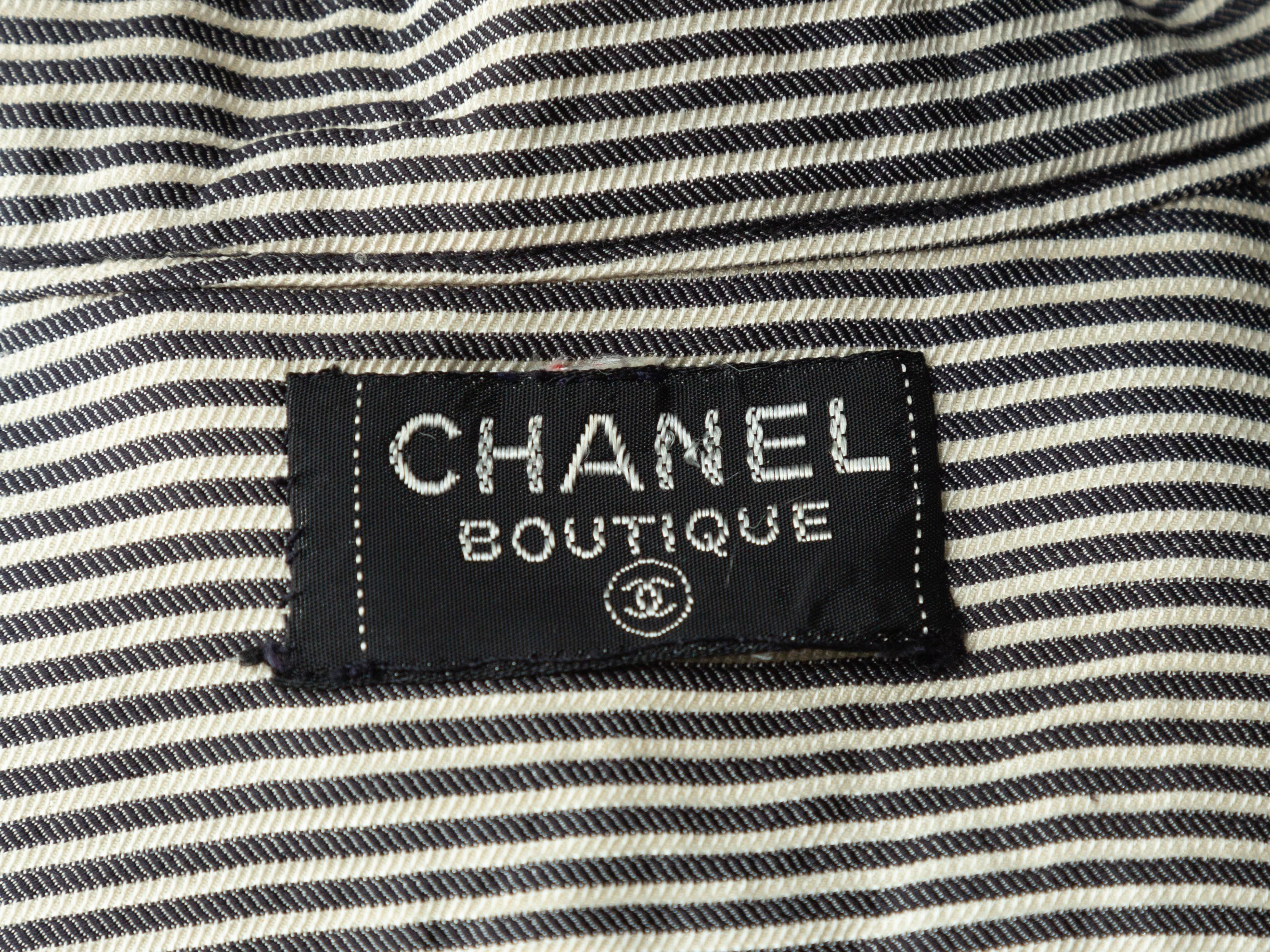 Product details: Vintage white and black striped long sleeve top by Chanel Boutique. Mandarin collar. Button closures at center front. 34