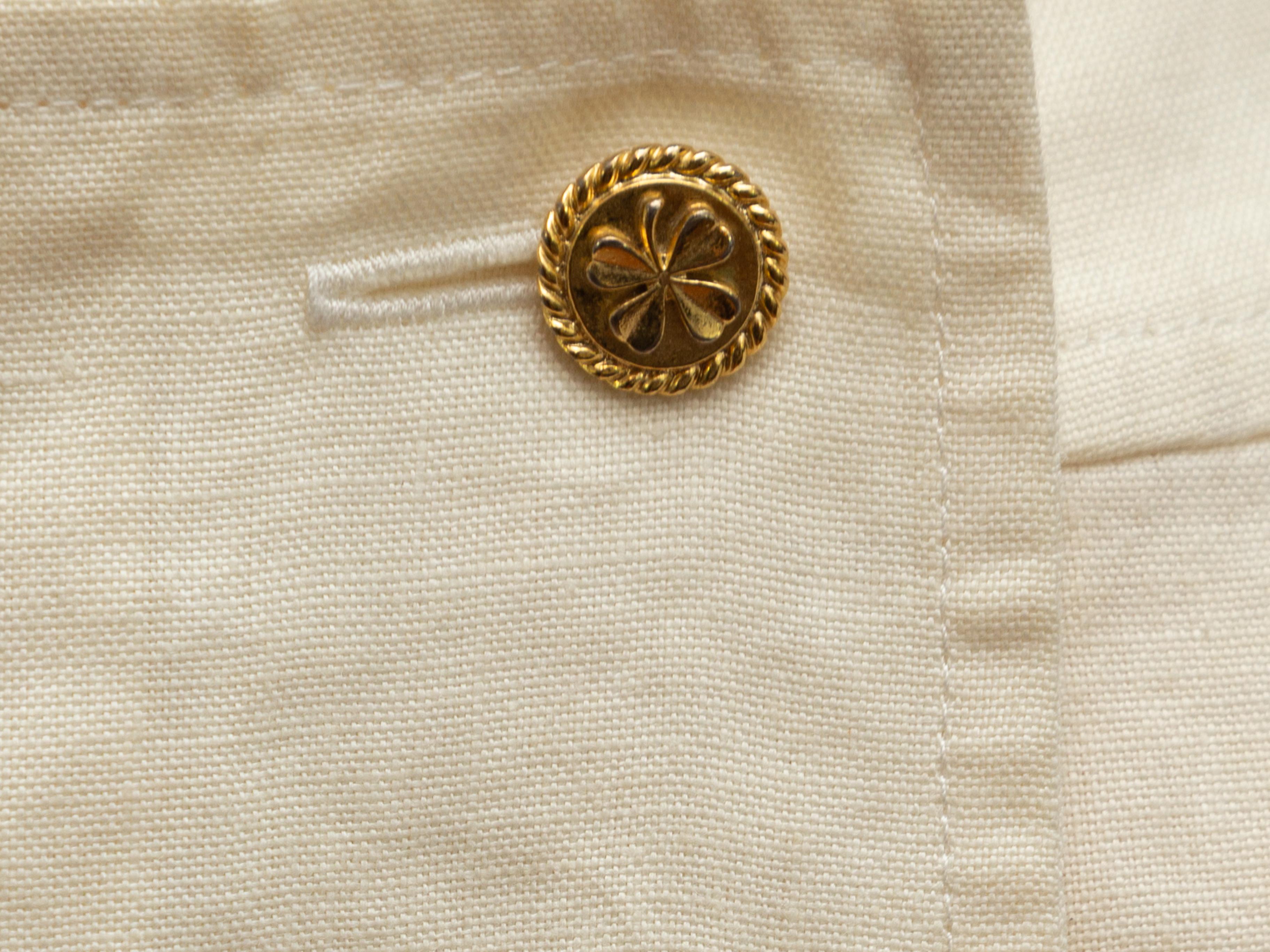 Product details: Vintage white linen sailor skirt by Chanel Boutique. Gold-tone buttons at front. Concealed zip closure at back. 30