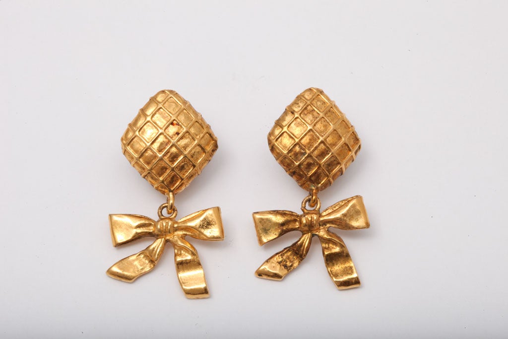 Chanel earrings with Chanel's iconic quilted details and bows.
Stamped Chanel Made in France.